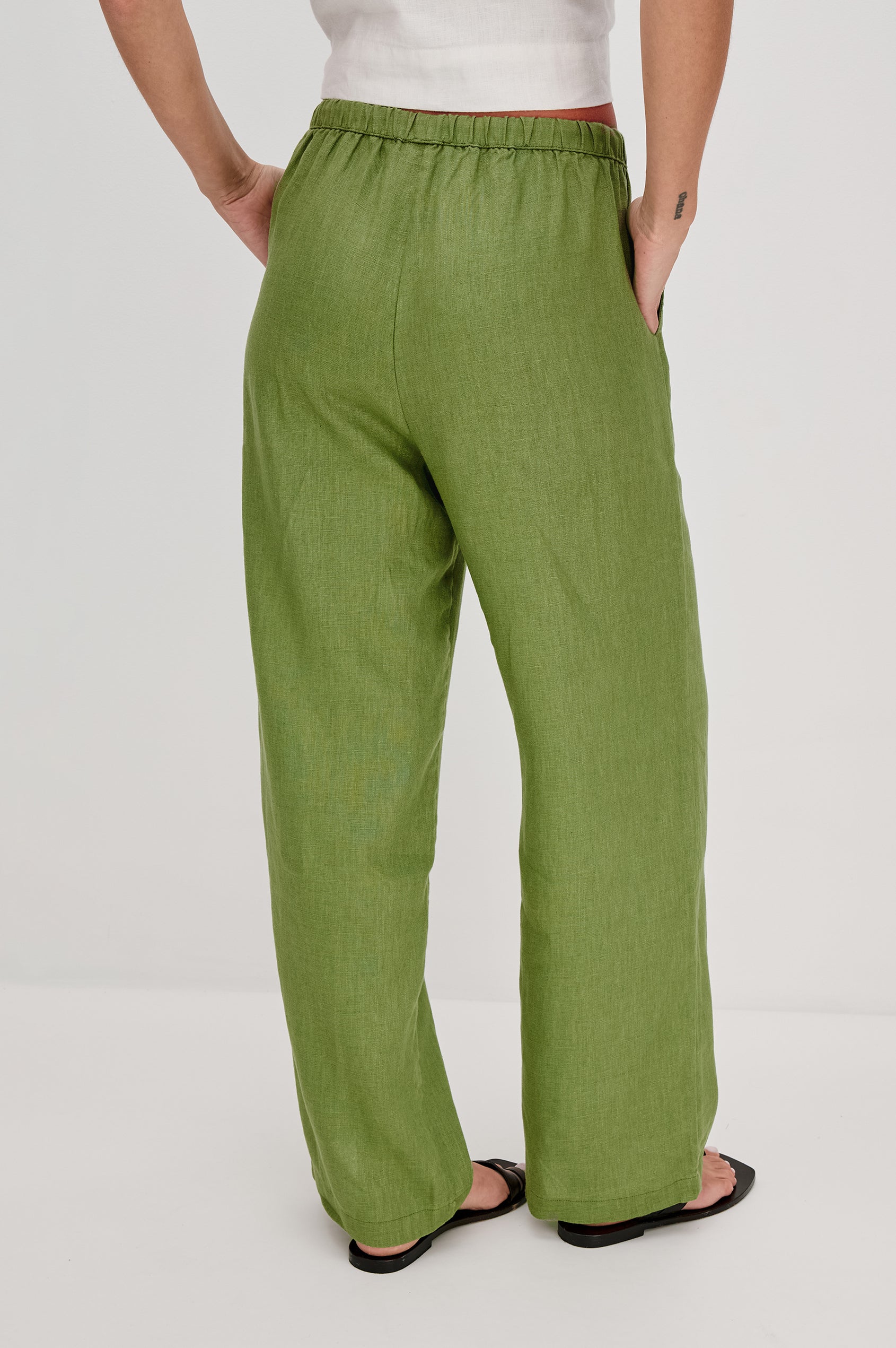 Emmie high rise linen wide leg pant with drawstring in Dill colorway- back view on model.