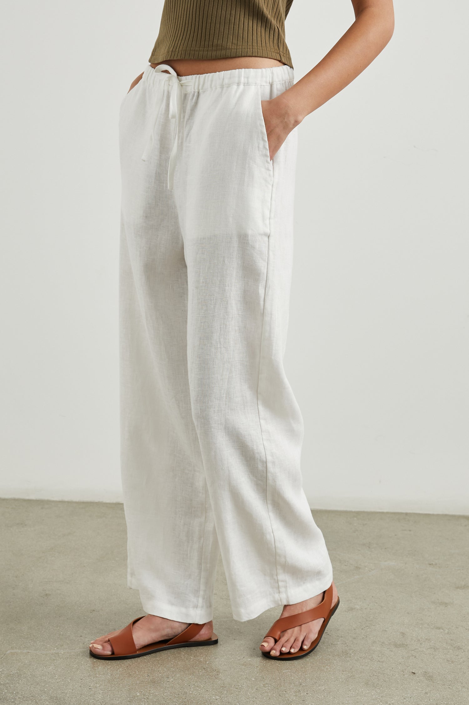 Emmie Pants with a Drawstring Waist and Two Front Pockets in White Colorway - Side View Featured on Model