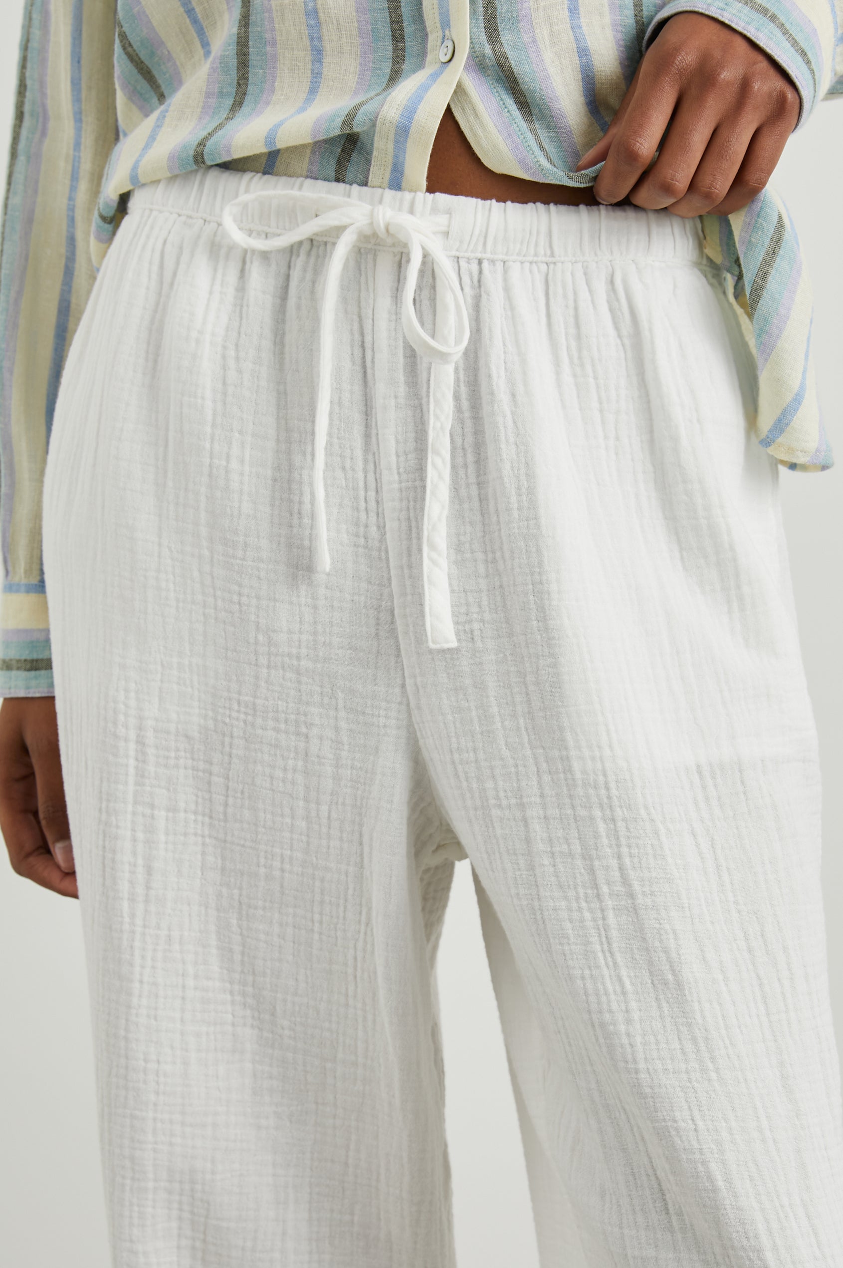 Emmie Pants with a Drawstring Waist and Two Front Pockets in Gauze White Colorway - Front View Featured on Model