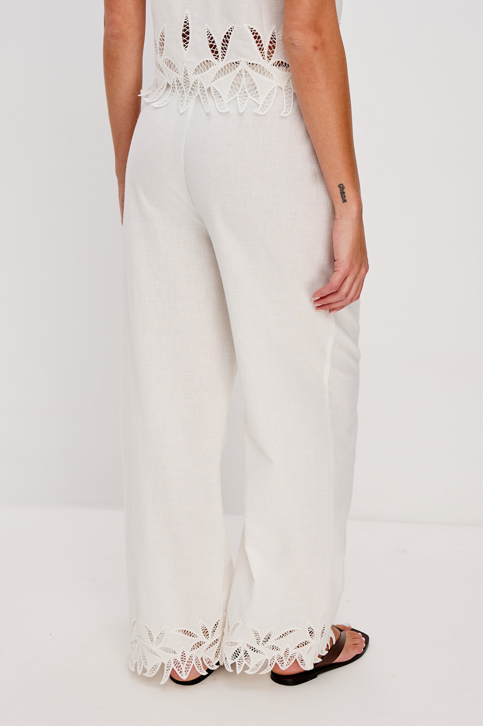 Emmie Straight Leg Pant with Adjustable Drawstring at Waist in White Palm Embroidery Colorway. Back View Shown on Model.