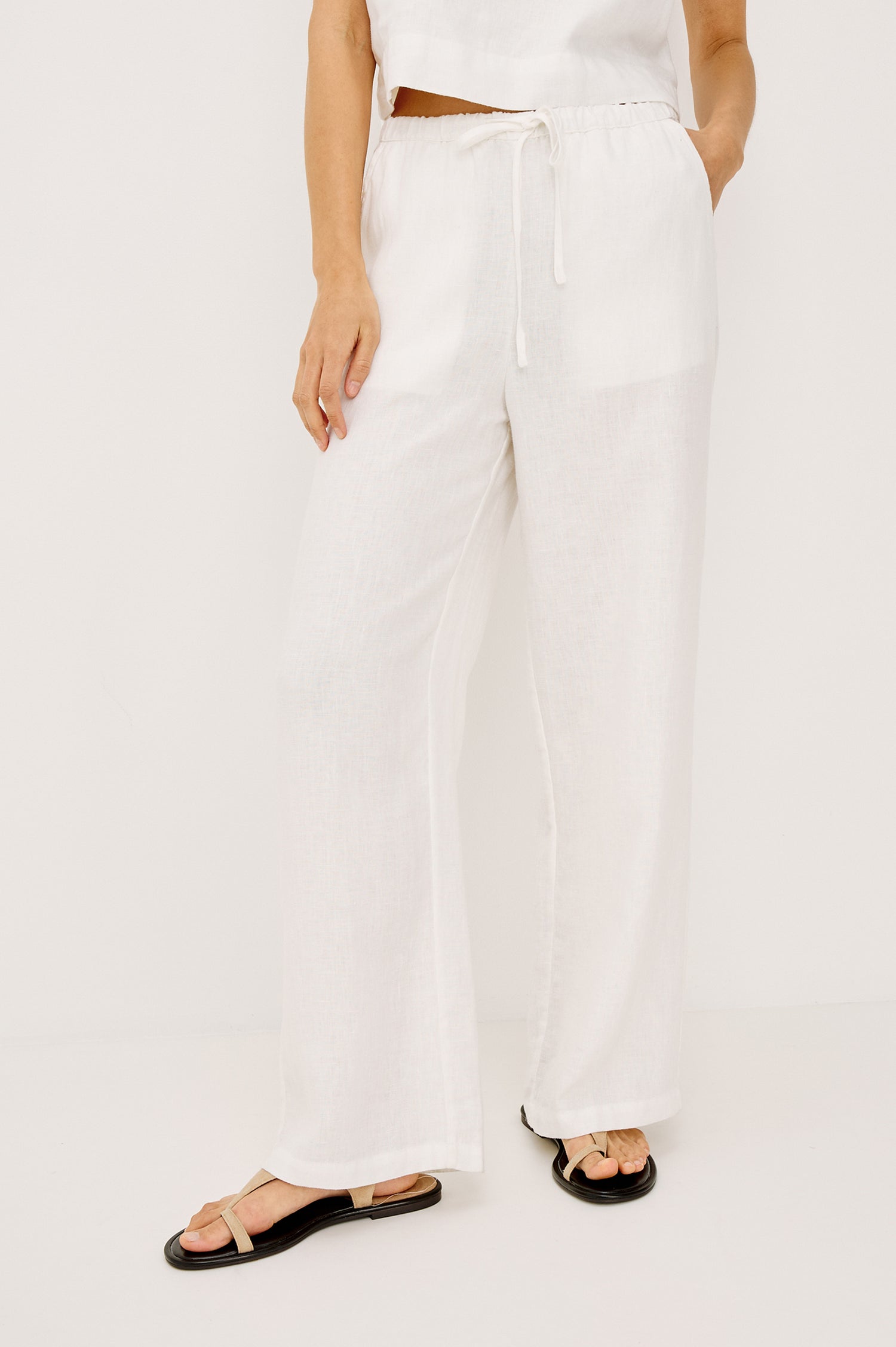 Emmie high rise linen wide leg pant with drawstring in white - front view on model