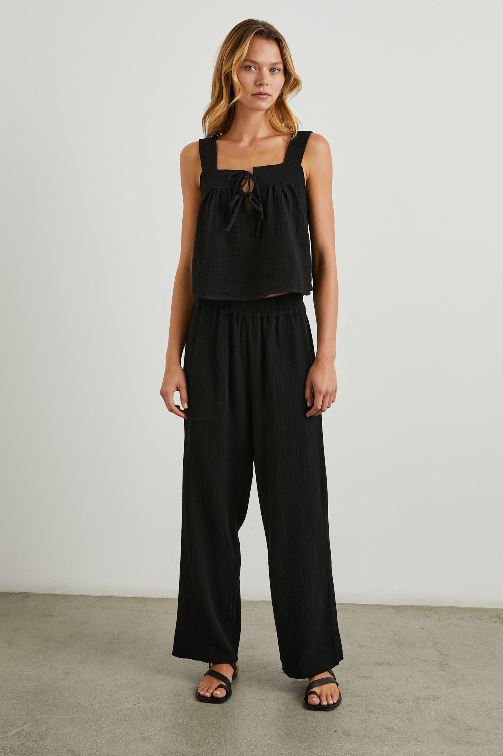 Enya Cropped Tank Top with a Square Neck with a V Cutout with Ties in Black Gauze Colorway - Front Full Body View Featured on Model