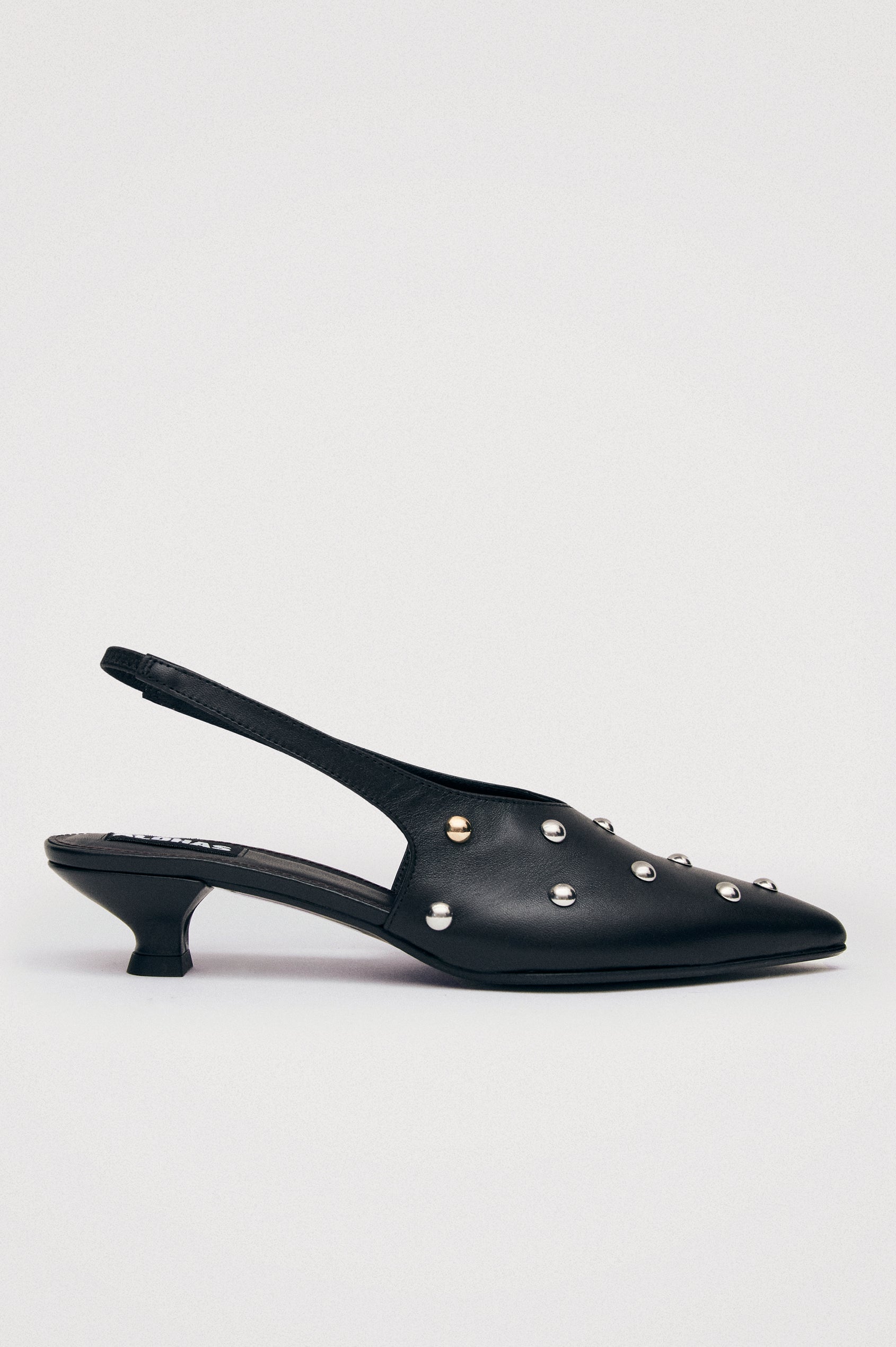 Crinkled leather slingback pump with elastic strap, pointed toe, and minimalist long vamp. Single shoe side view.