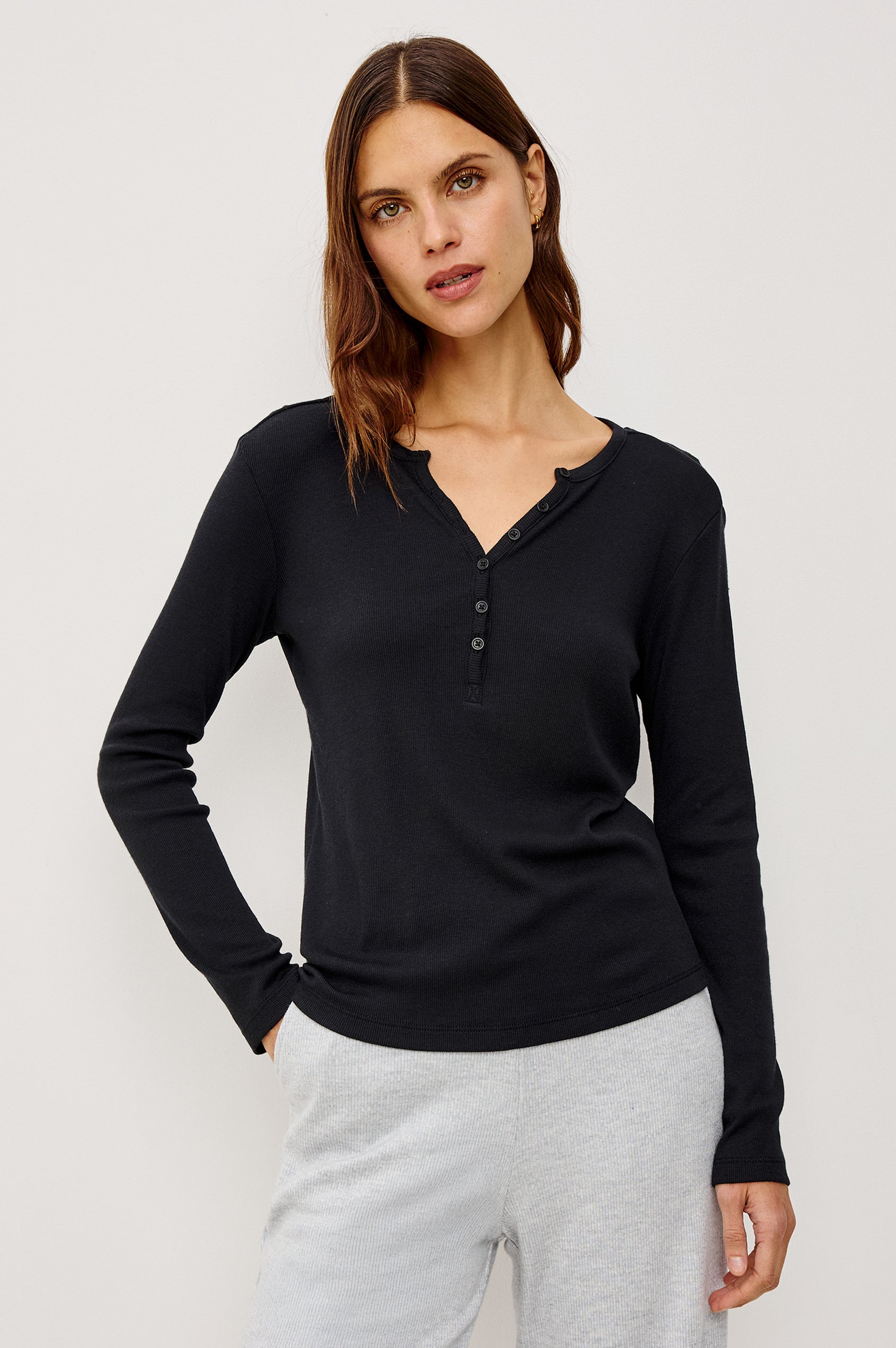 Essential Long-Sleeve Finely Ribbed Henley, with a V Neck and a Placket with Buttons in Black Colorway - Front View Featured on Model 