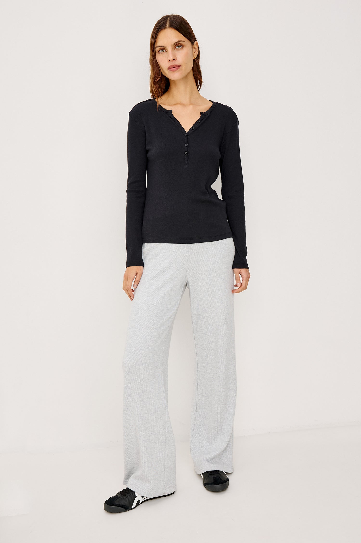 Essential Long-Sleeve Finely Ribbed Henley, with a V Neck and a Placket with Buttons in Black Colorway - Front Full Body View Featured on Model 