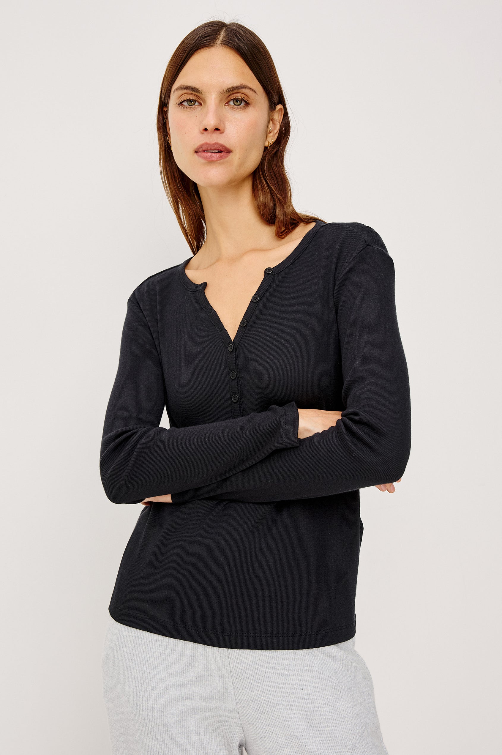 Essential Long-Sleeve Finely Ribbed Henley, with a V Neck and a Placket with Buttons in Black Colorway - Front View Featured on Model 