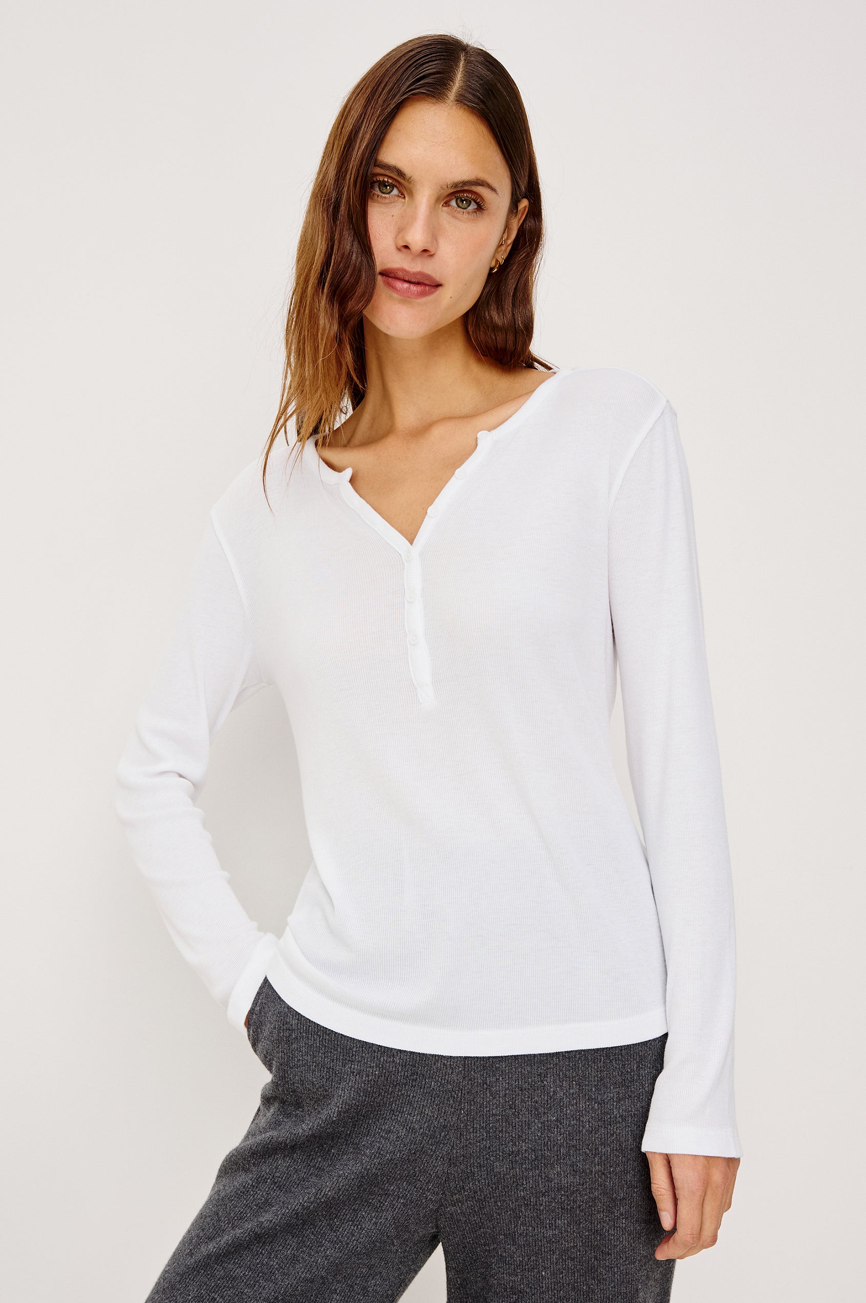 Essential Long-Sleeve Finely Ribbed Henley, with a V Neck and a Placket with Buttons in White Colorway - Front Tucked View Featured on Model 