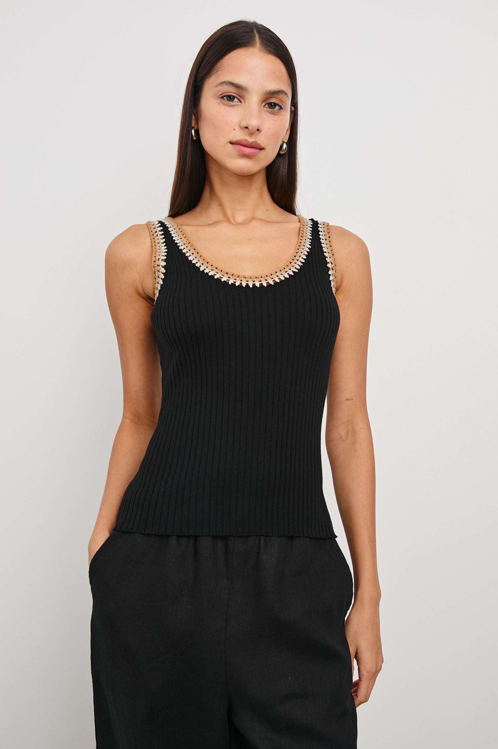 Estrella Ribbed Cami with a Scoop Neck and Crochet Trim Along the Straps and Neckline in Black Colorway with White, Beige, and Tan Trim - Front View Featured on Model