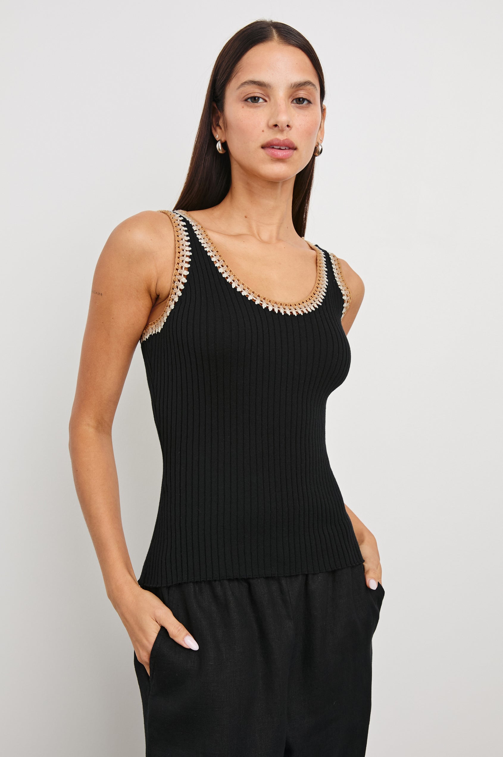 Estrella Ribbed Cami with a Scoop Neck and Crochet Trim Along the Straps and Neckline in Black Colorway with White, Beige, and Tan Trim - Front View Featured on Model