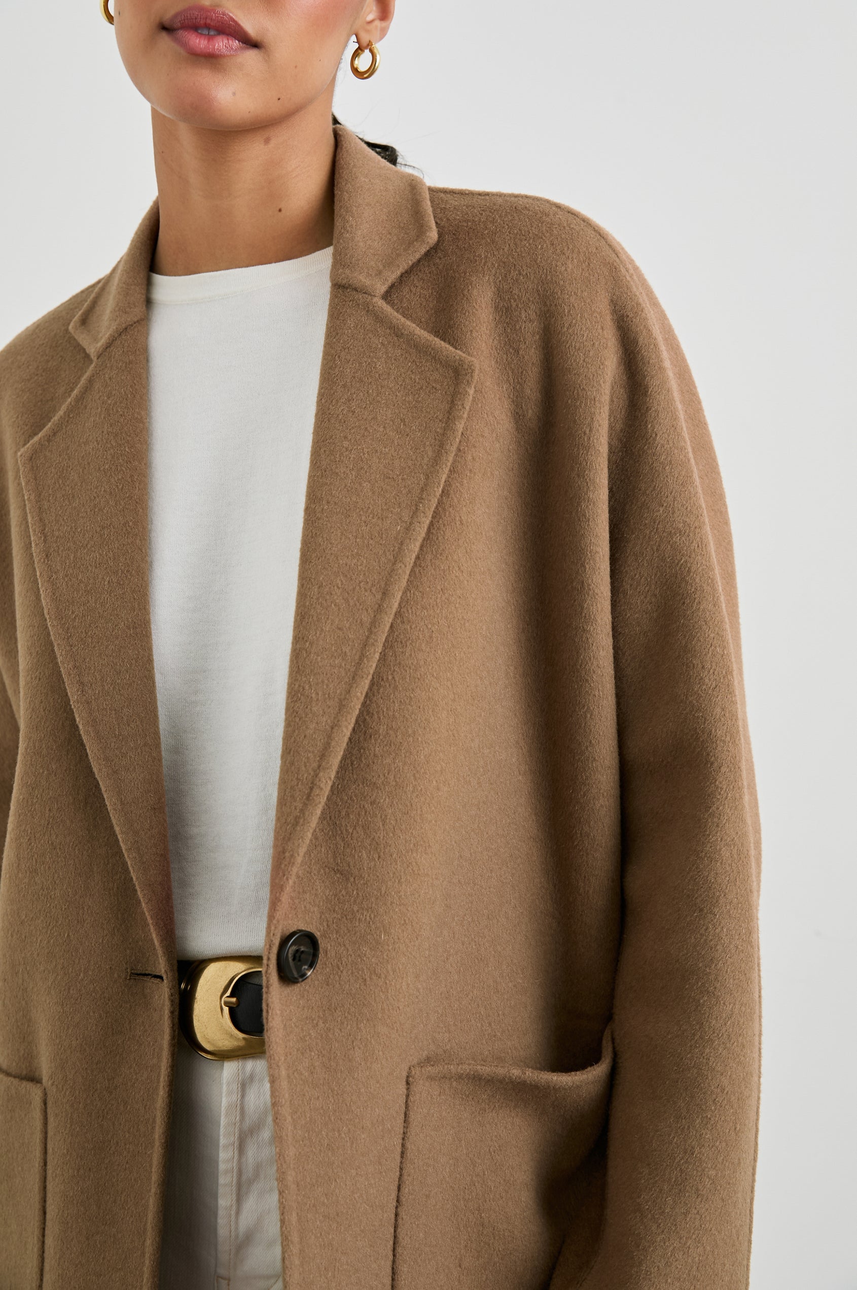 Everest Mid-Thigh Length Coat with Single Button Closure, Notched Lapels and Front Patch Pockets in Camel Colorway - Front View Featured on Model