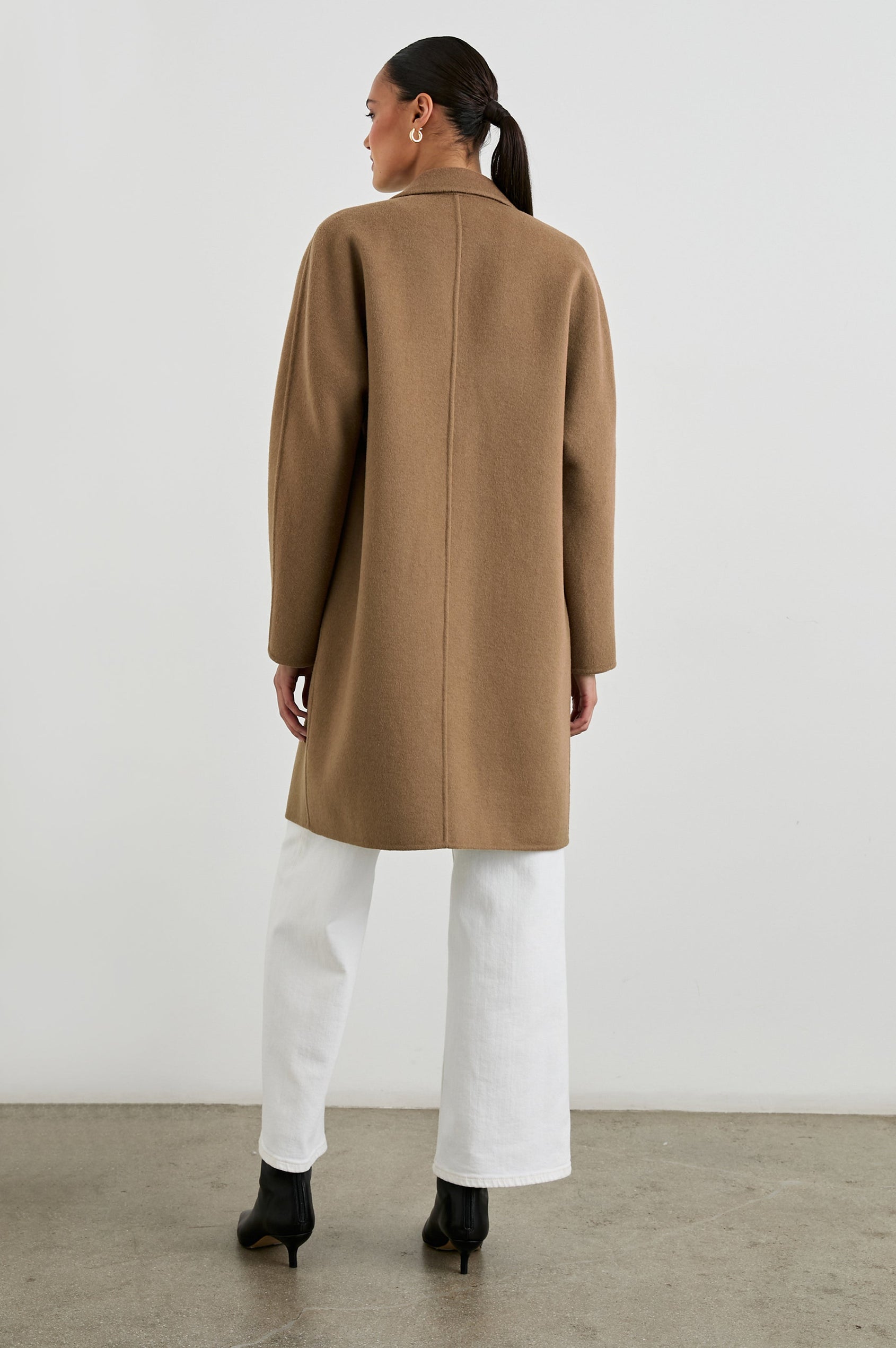 Everest Mid-Thigh Length Coat with Single Button Closure, Notched Lapels and Front Patch Pockets in Camel Colorway - Back Full Body View Featured on Model