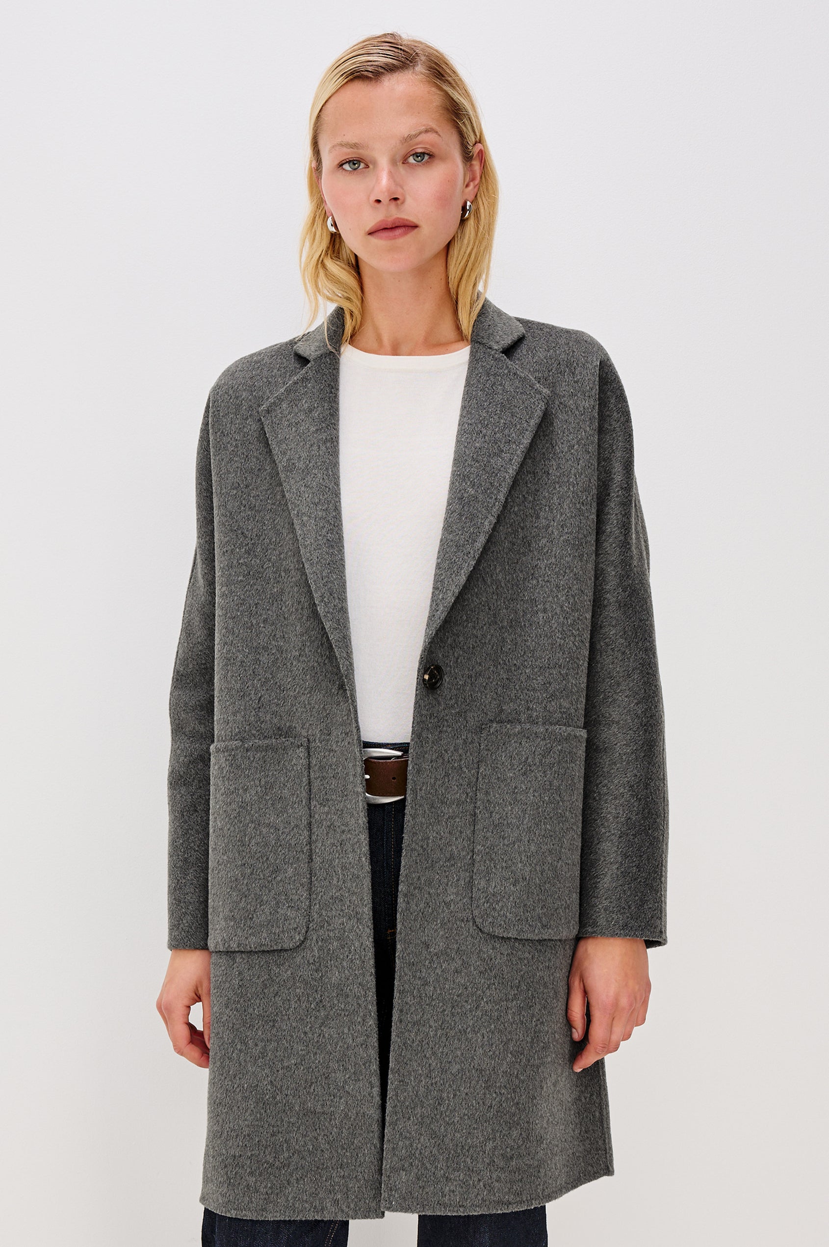 Everest Mid-Thigh Length Coat with Single Button Closure, Notched Lapels and Front Patch Pockets in Charcoal Colorway - Front View Featured on Model