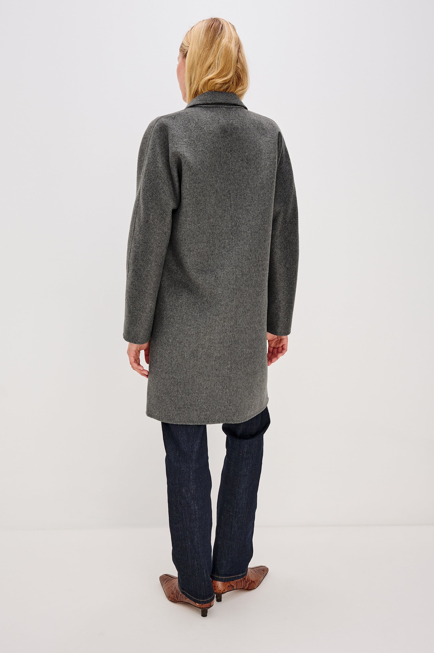 Everest Mid-Thigh Length Coat with Single Button Closure, Notched Lapels and Front Patch Pockets in Charcoal Colorway - Back View Featured on Model