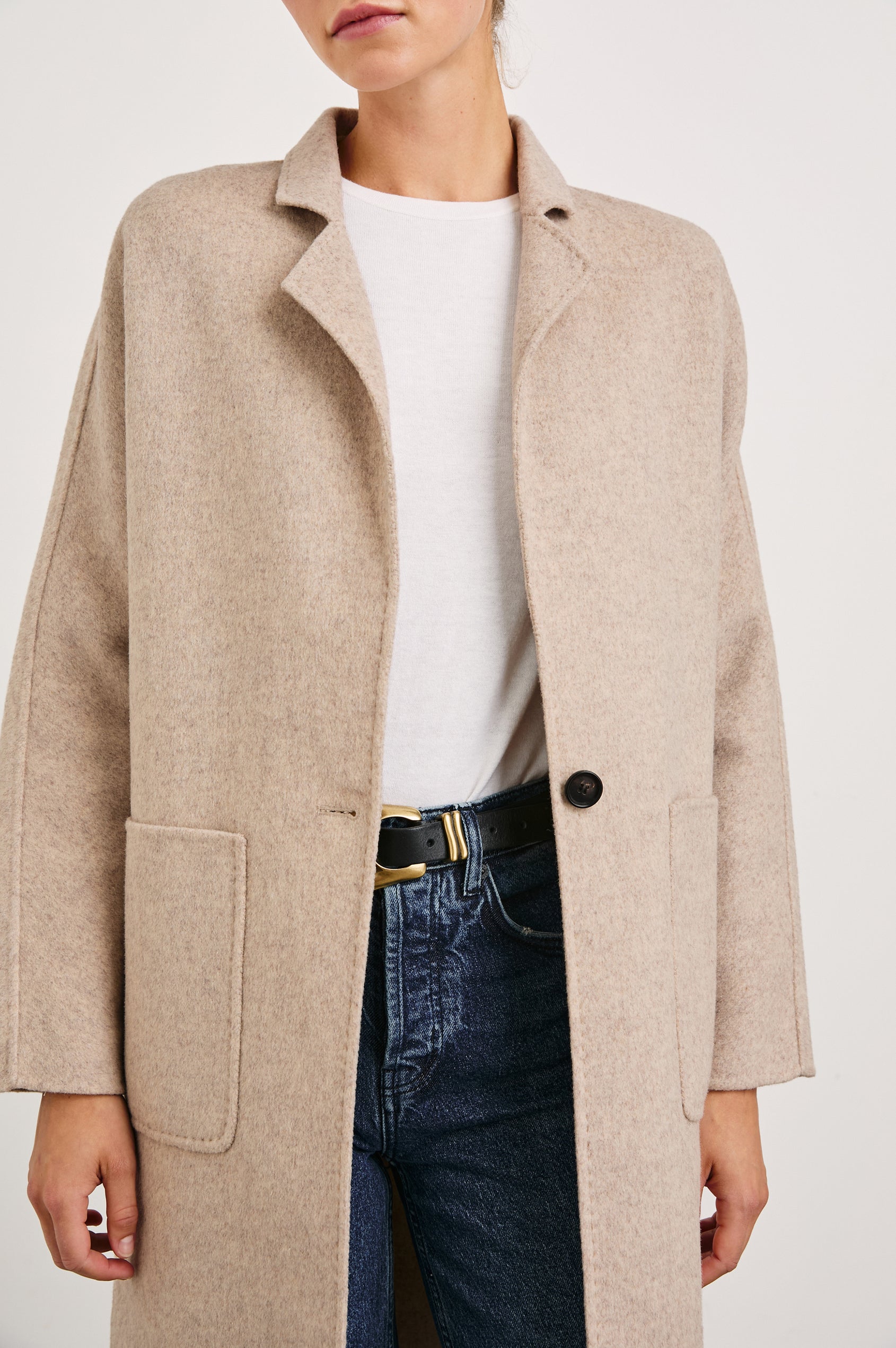 Everest Mid-Thigh Length Coat with Single Button Closure, Notched Lapels and Front Patch Pockets in Oatmeal Colorway - Front View Featured on Model