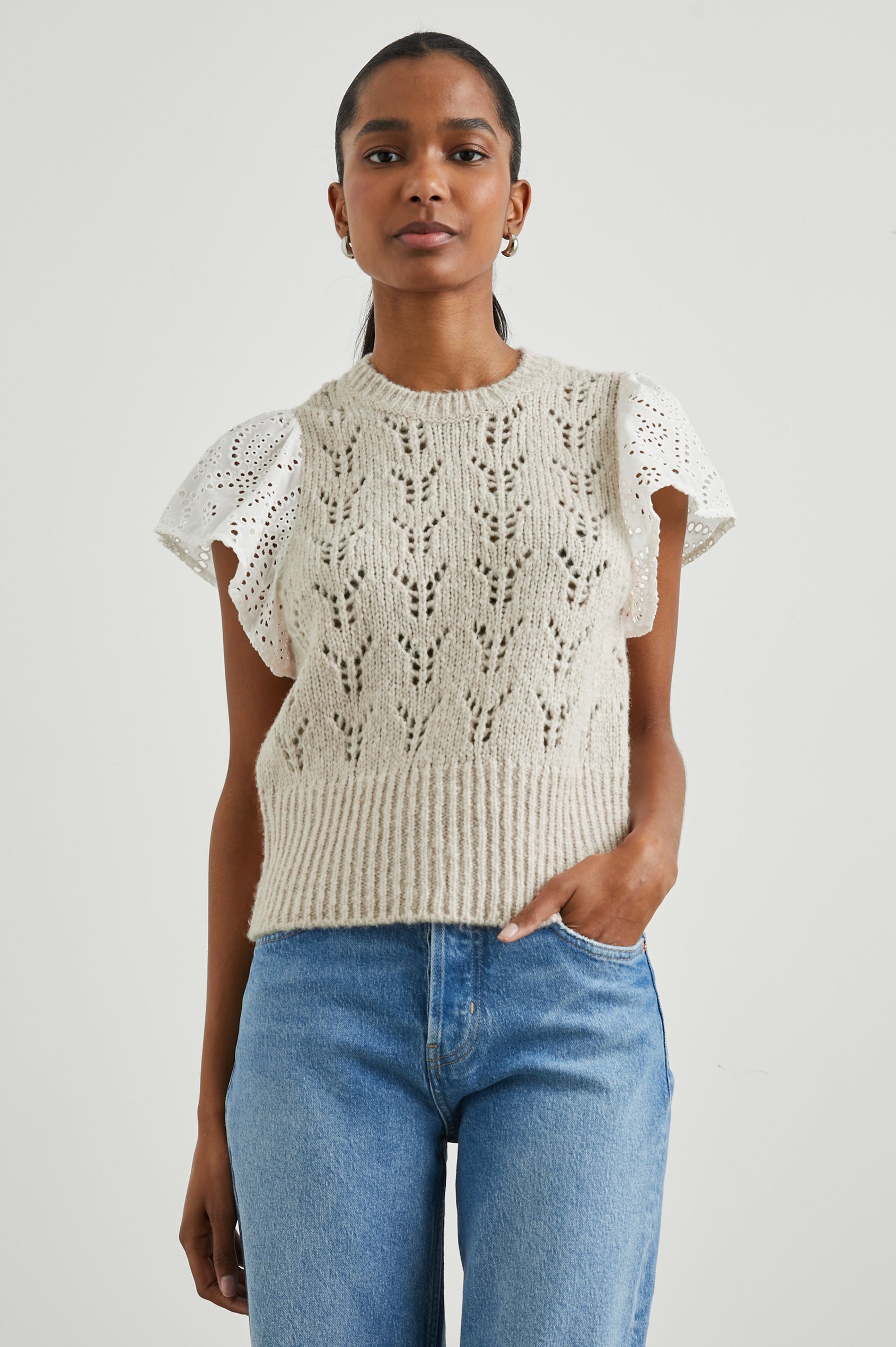 Everly Top with a Knit Bodice with Ribbed Trim and a Crew Neck and White Cotton Short Sleeves with Eyelets In Oat Colorway - Front View Featured on Model