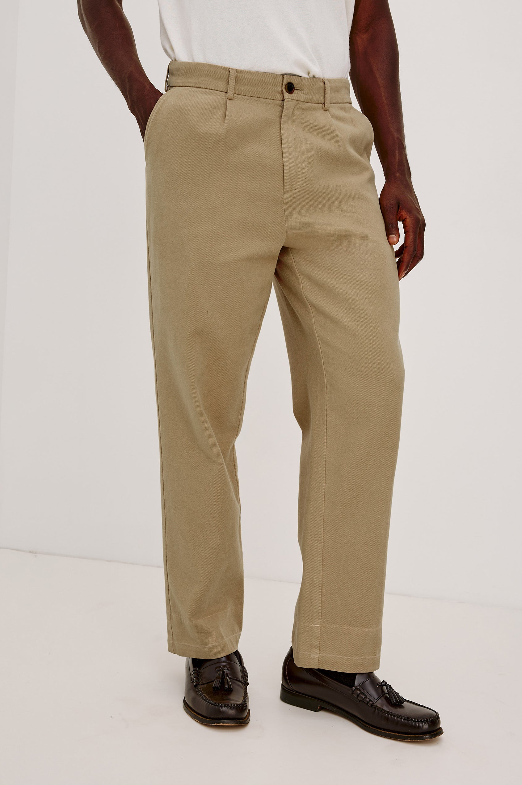 Ezra Pant in Brushed Cotton Twill With Relaxed Fit, Single Front Pleats, Ankle-Length Hem, Zip Fly, Side Pockets, and Back Double-Welt Pockets in British Khaki Colorway - Lower Body Front View Featured on Model