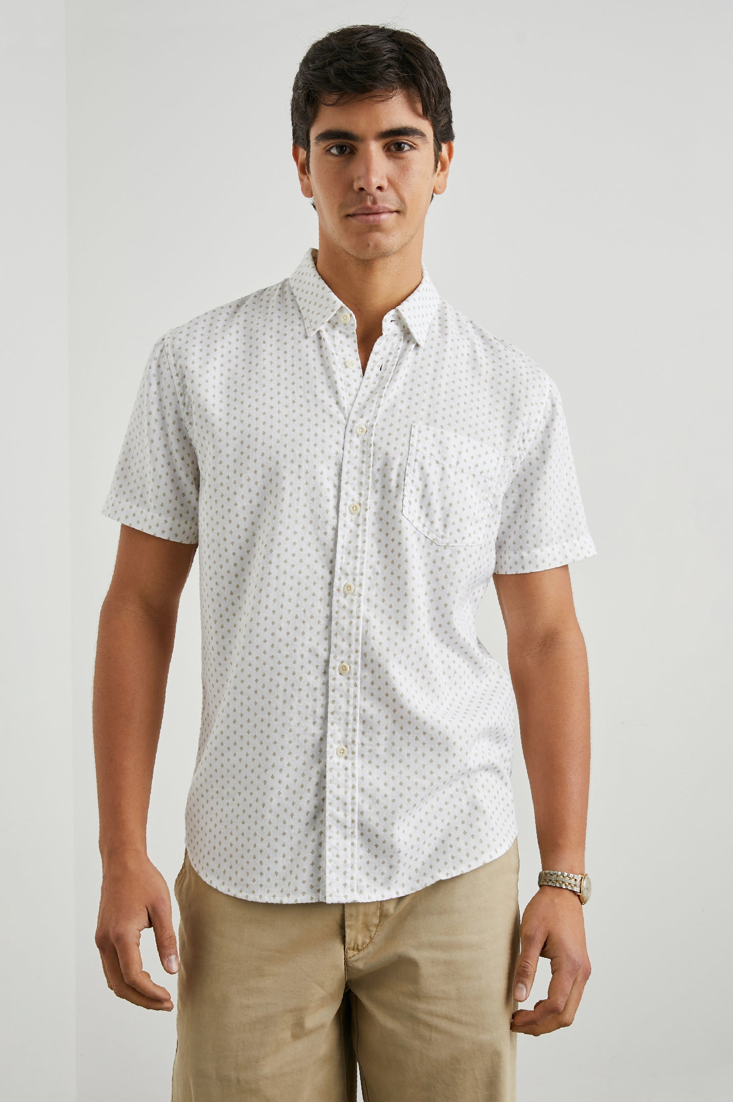 Fairfax Short-Sleeve Button Up with a Chest Patch Pocket in Polygon Micro White Colorway, with small polygons on White - Front View Featured on Model