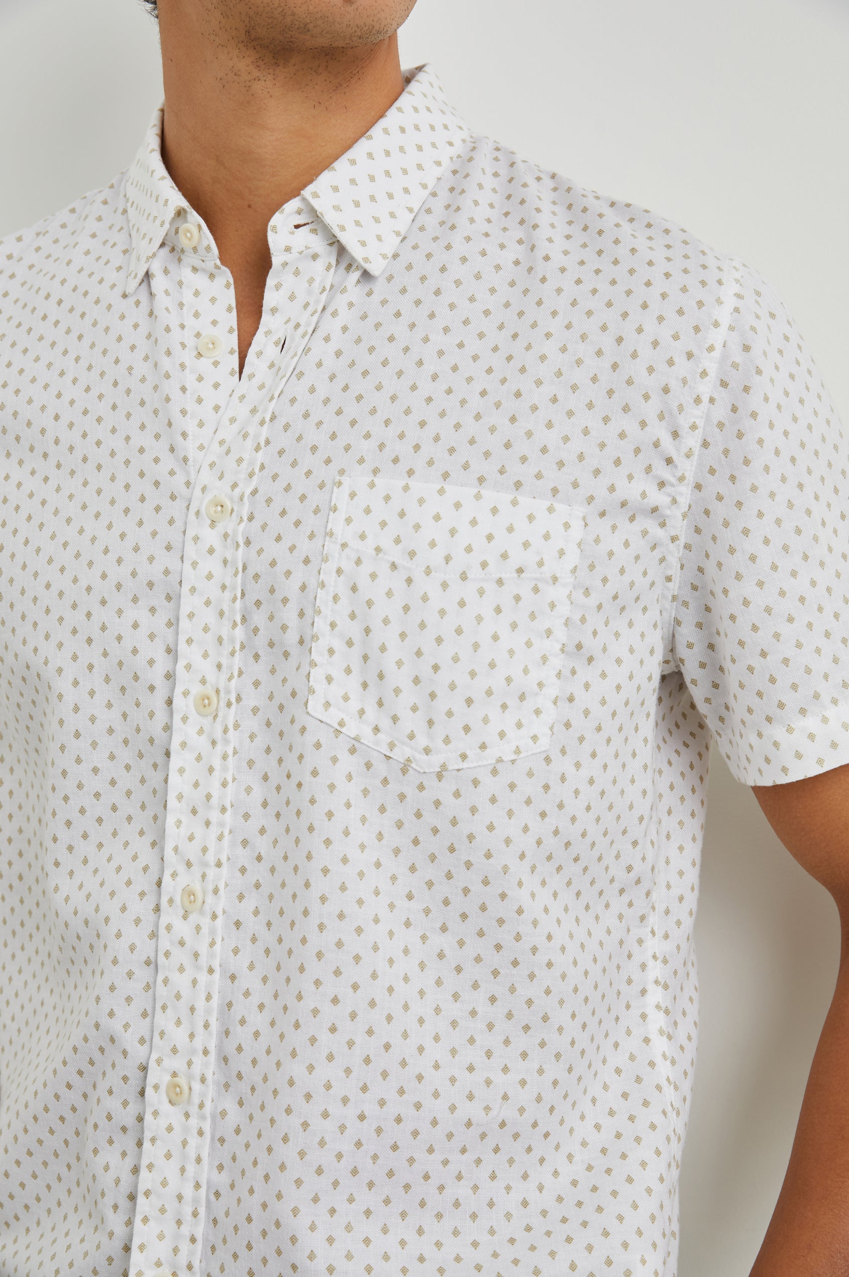 Fairfax Short-Sleeve Button Up with a Chest Patch Pocket in Polygon Micro White Colorway, with small polygons on White - Front View Featured on Model