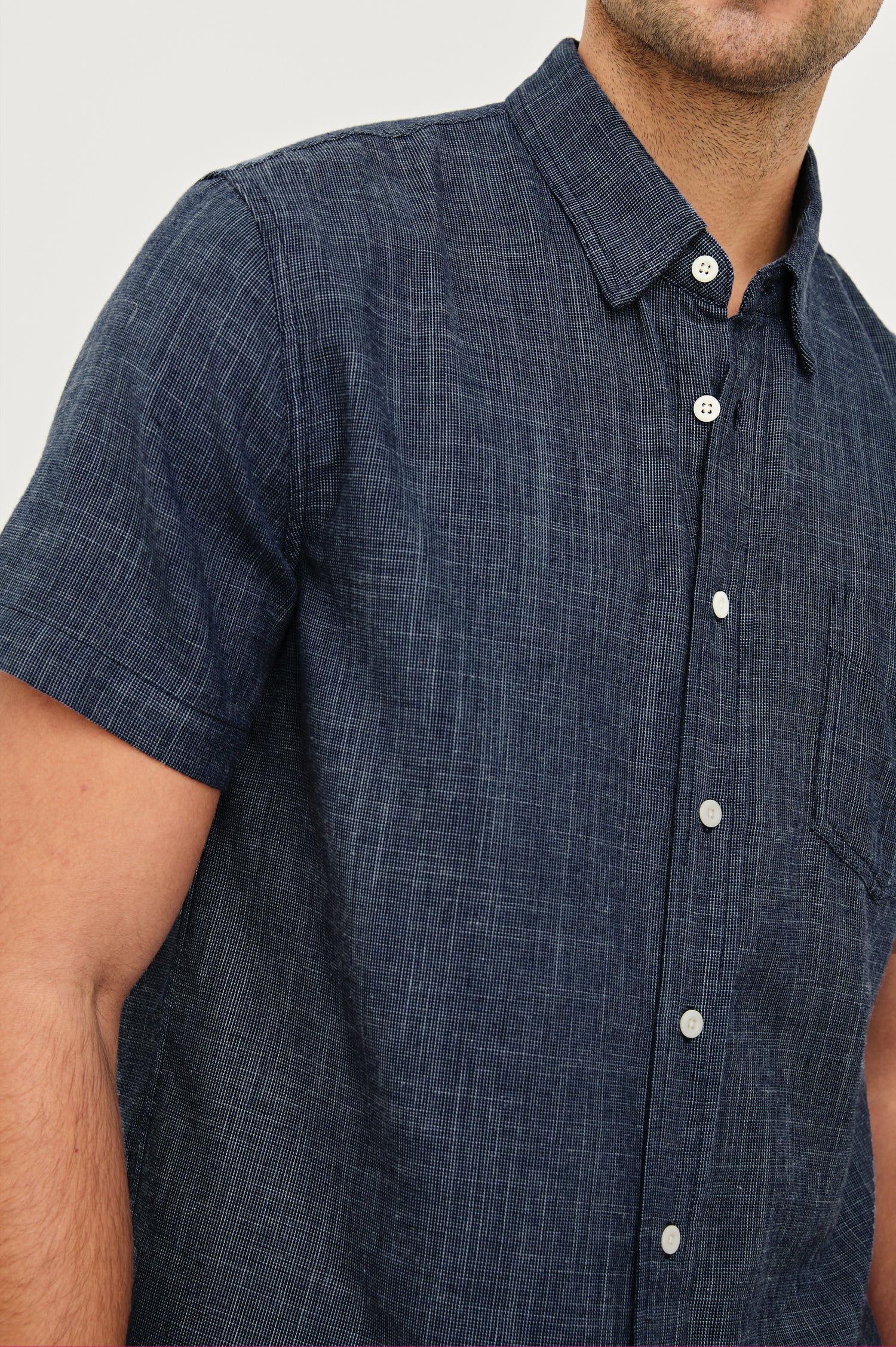 Fairfax short sleeve relaxed fit button up shirt with collar and chest pocket in Navy Etch - close up of details on model