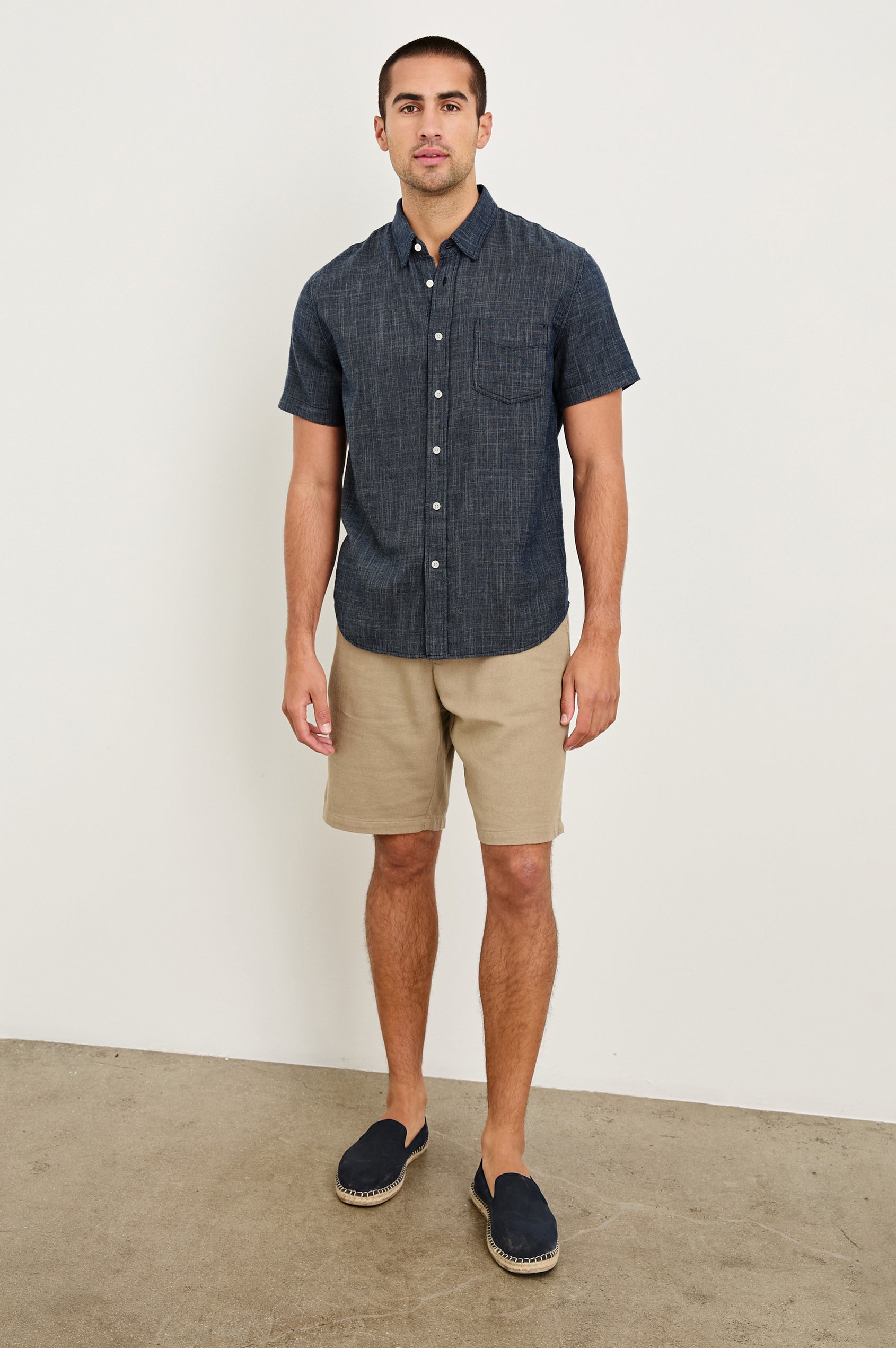 Fairfax short sleeve relaxed fit button up shirt with collar and chest pocket in Navy Etch - full body front view on model