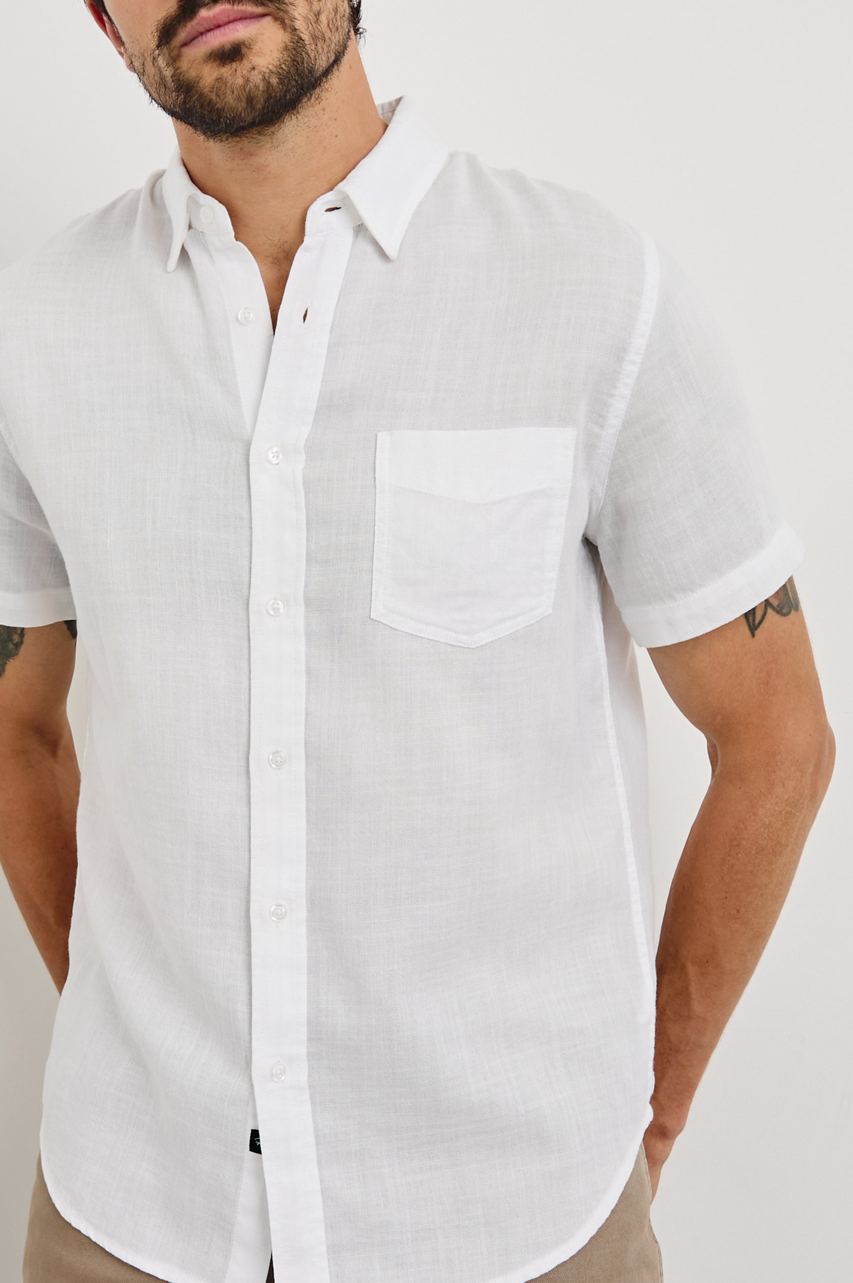 Fairfax short sleeve relaxed fit button up shirt with collar and chest pocket in White - close up of details on model