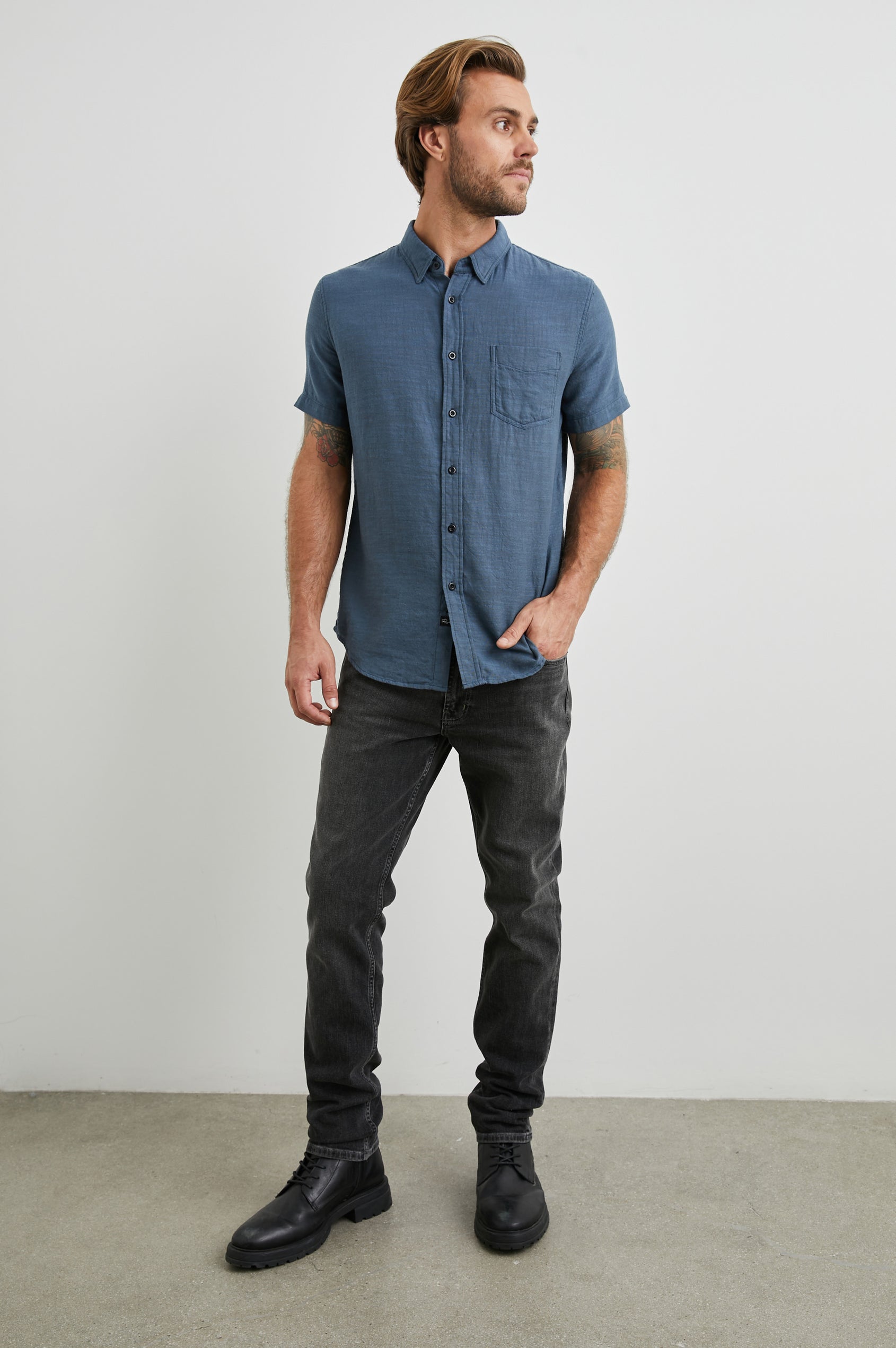 Fairfax Short-Sleeve Button Up with a Chest Patch Pocket in Sea Blue Colorway - Front Full Body View Featured on Model