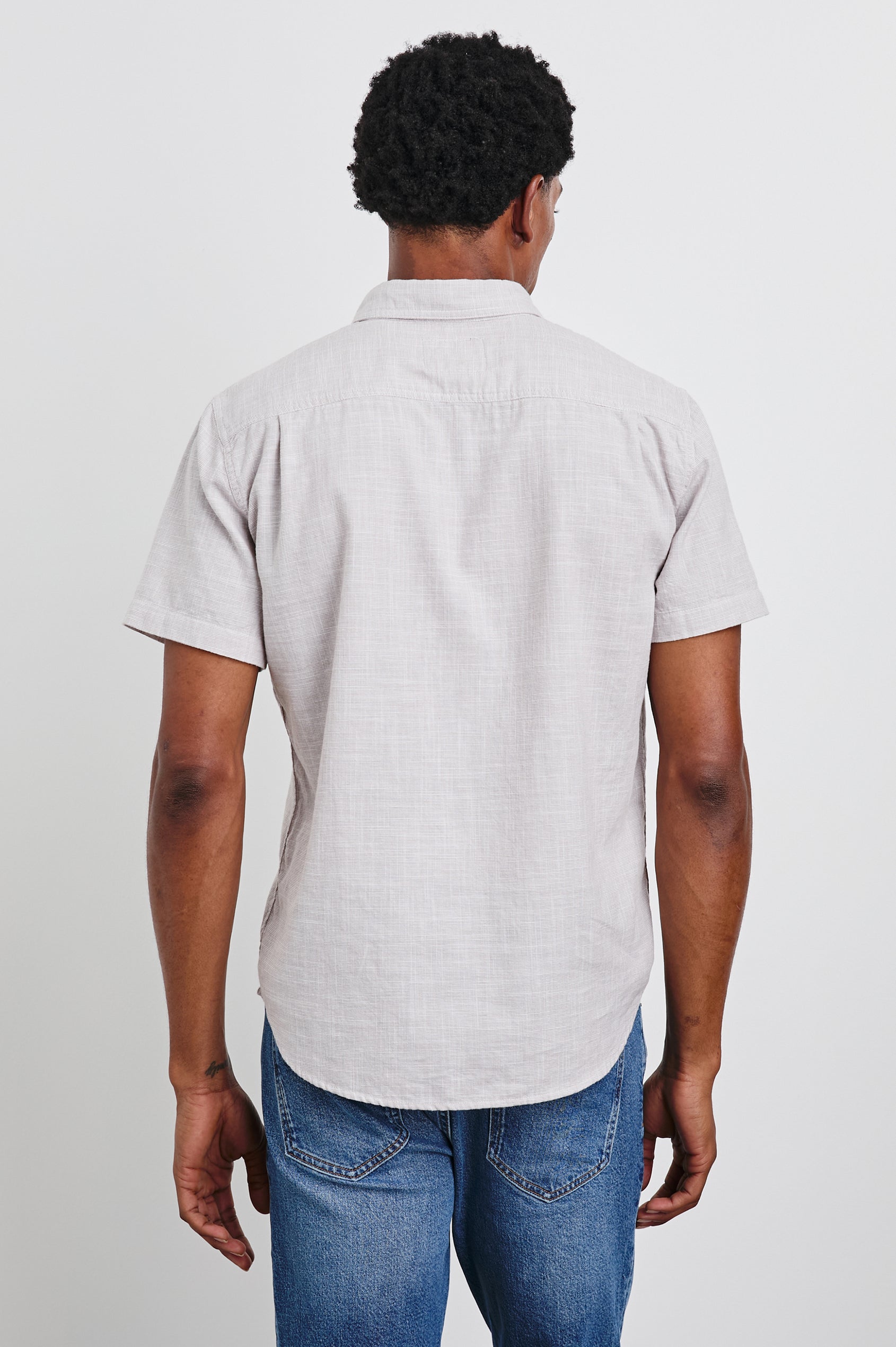 Fairfax Short-Sleeve Button Up with a Chest Patch Pocket in Tahini Etch Colorway - Back View Featured on Model