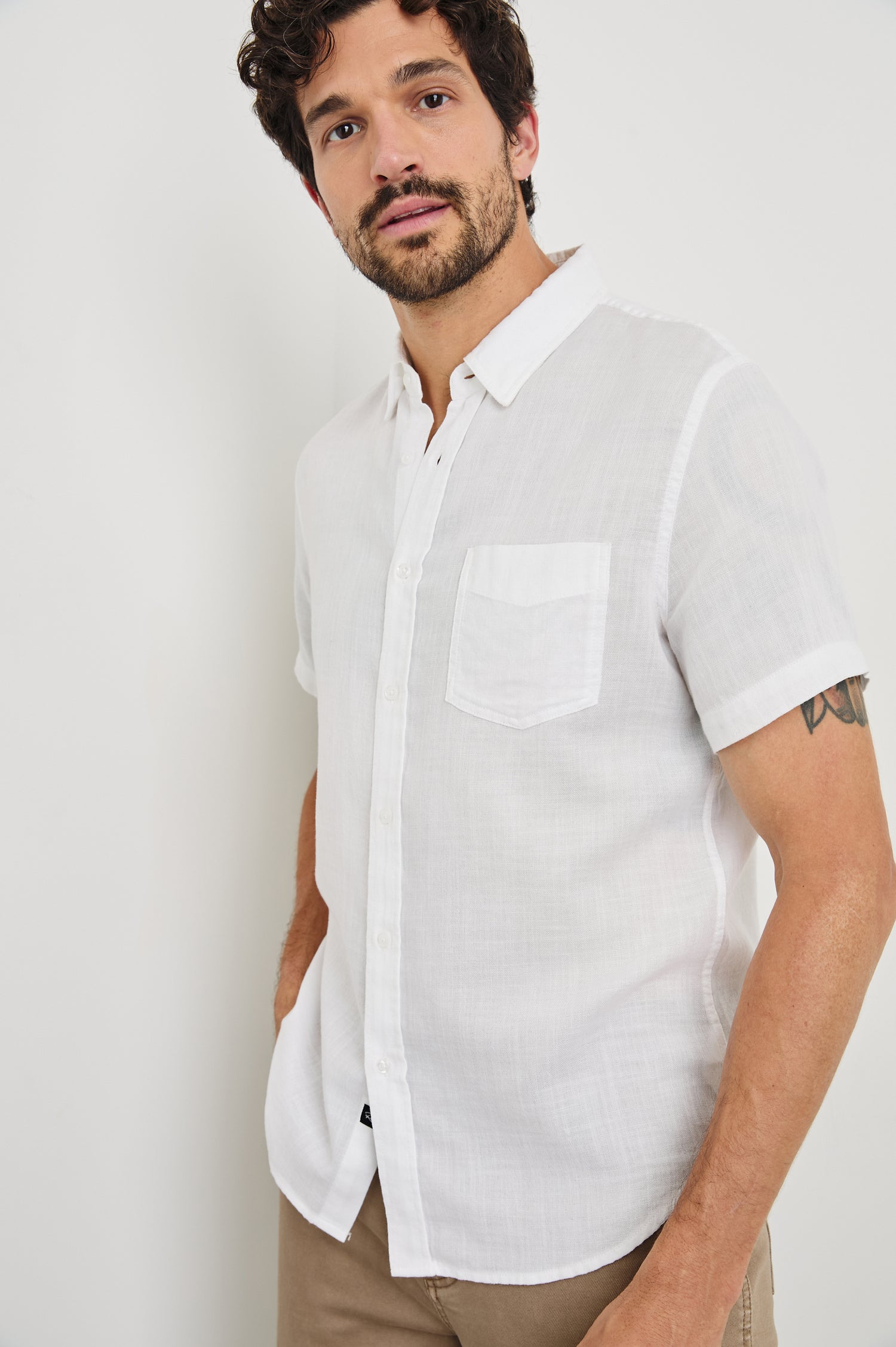 Fairfax short sleeve button up shirt with collar and chest pocket in White - front view on model
