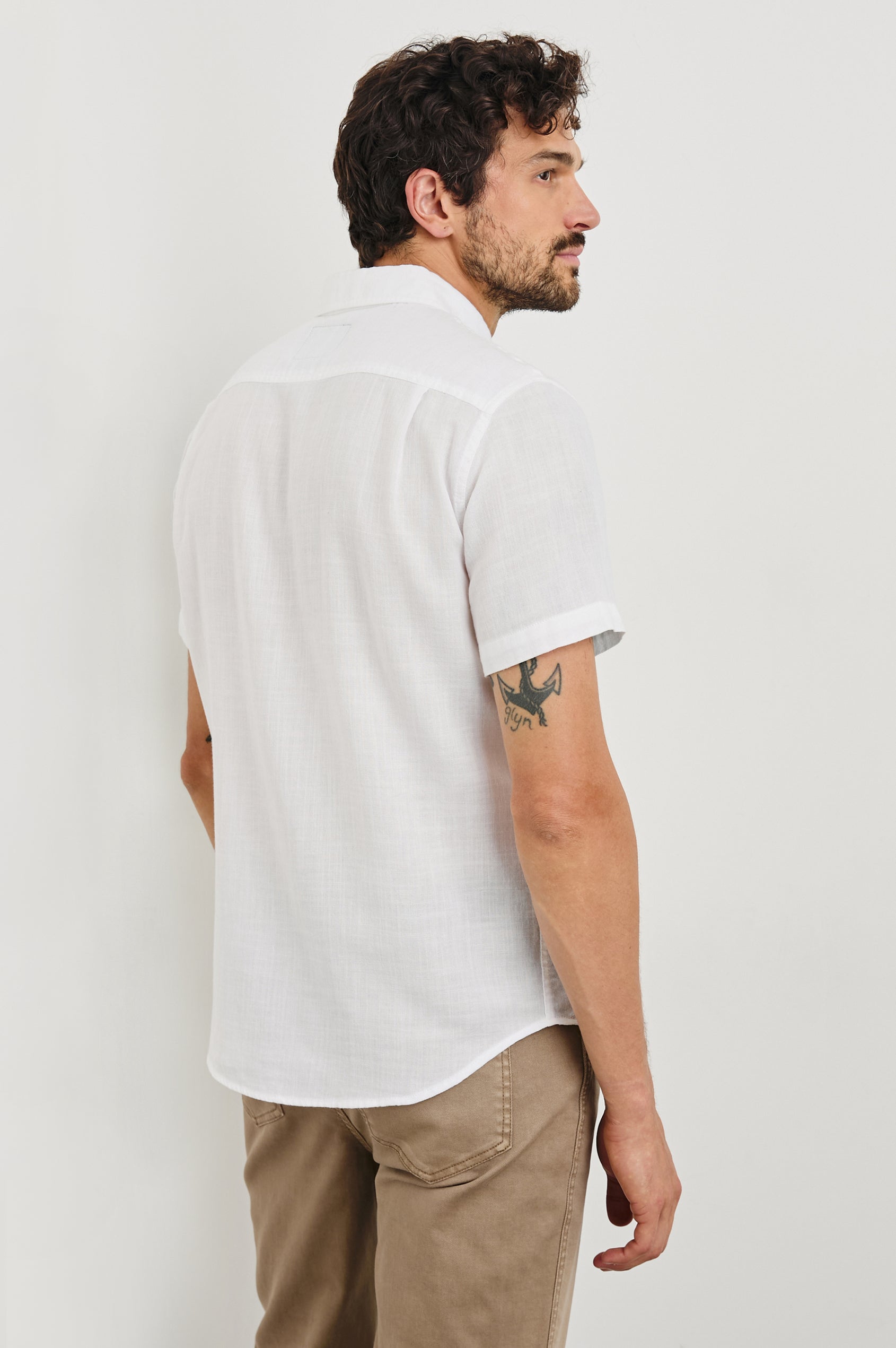 Fairfax short sleeve button up shirt with collar and chest pocket in White - back view on model