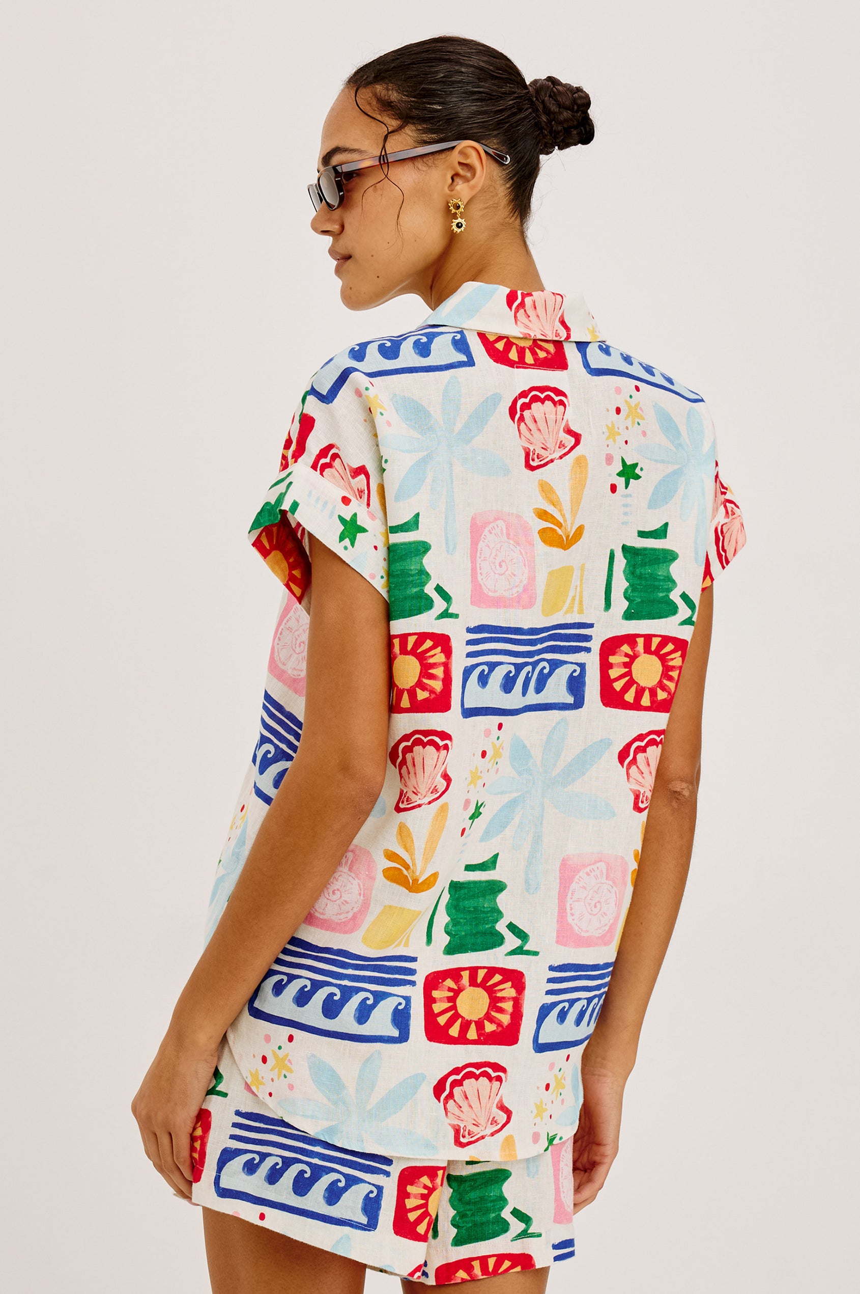 Jenner Short in Linen With High-Rise, Adjustable Drawstring Ties, Relaxed Fit, and Side Pockets in Bahama Colorway - Upper Body Back View Featured on Model