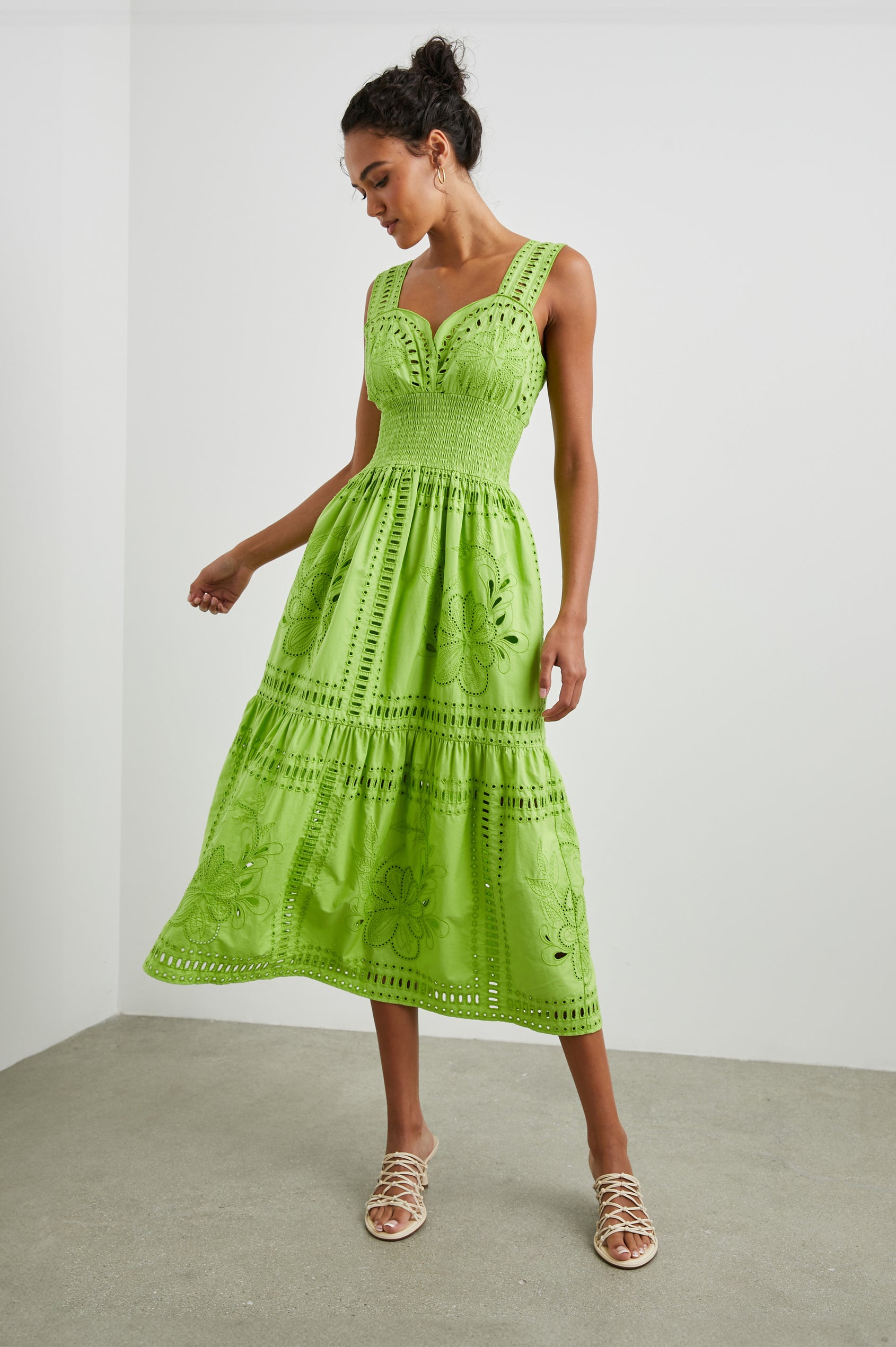 Fawn Sleeveless Midi Dress with Wide Straps, a Sweetheart Neckline, a Cinched Waist and Floral and Geometric Eyelet Details in Island Green Colorway - Front Full Body View Featured on Model