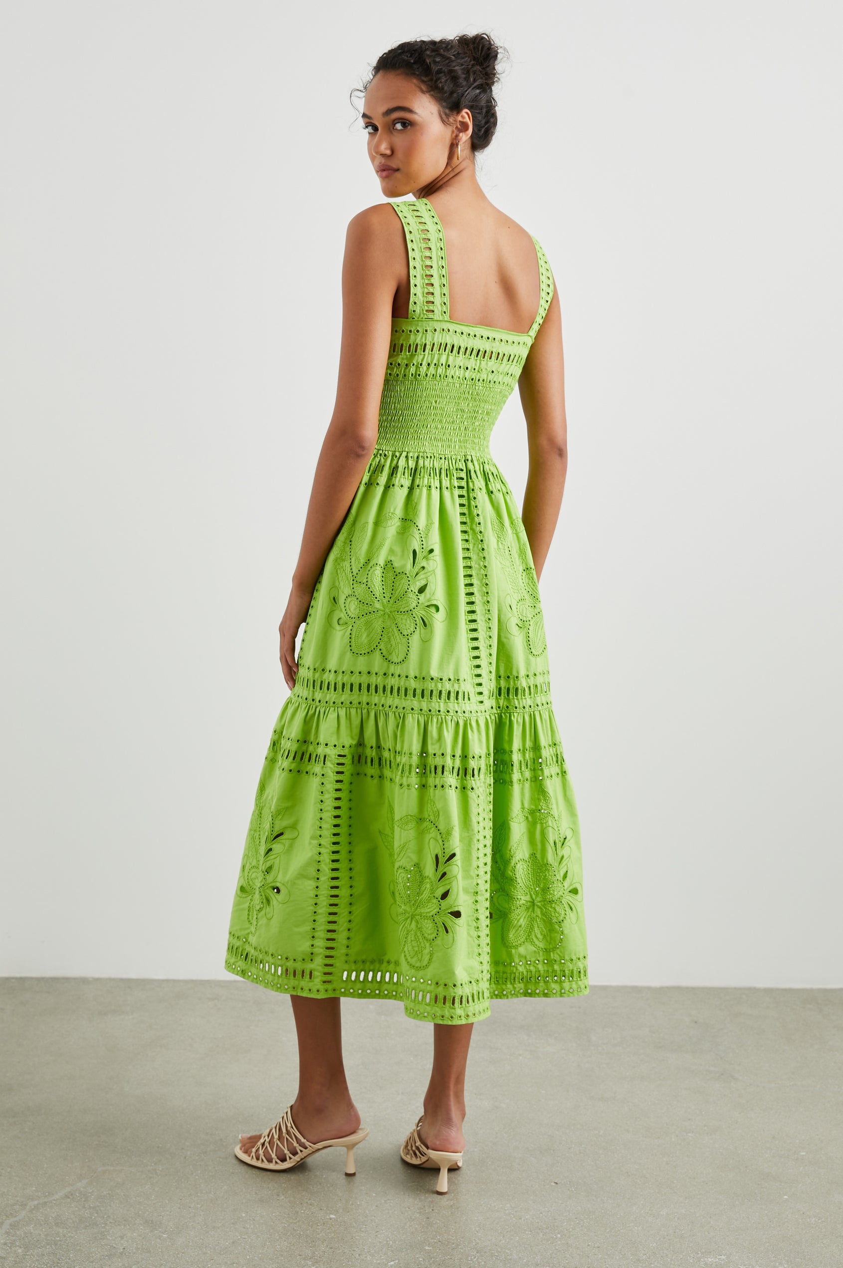 Fawn Sleeveless Midi Dress with Wide Straps, a Sweetheart Neckline, a Cinched Waist and Floral and Geometric Eyelet Details in Island Green Colorway - Back Full Body View Featured on Model