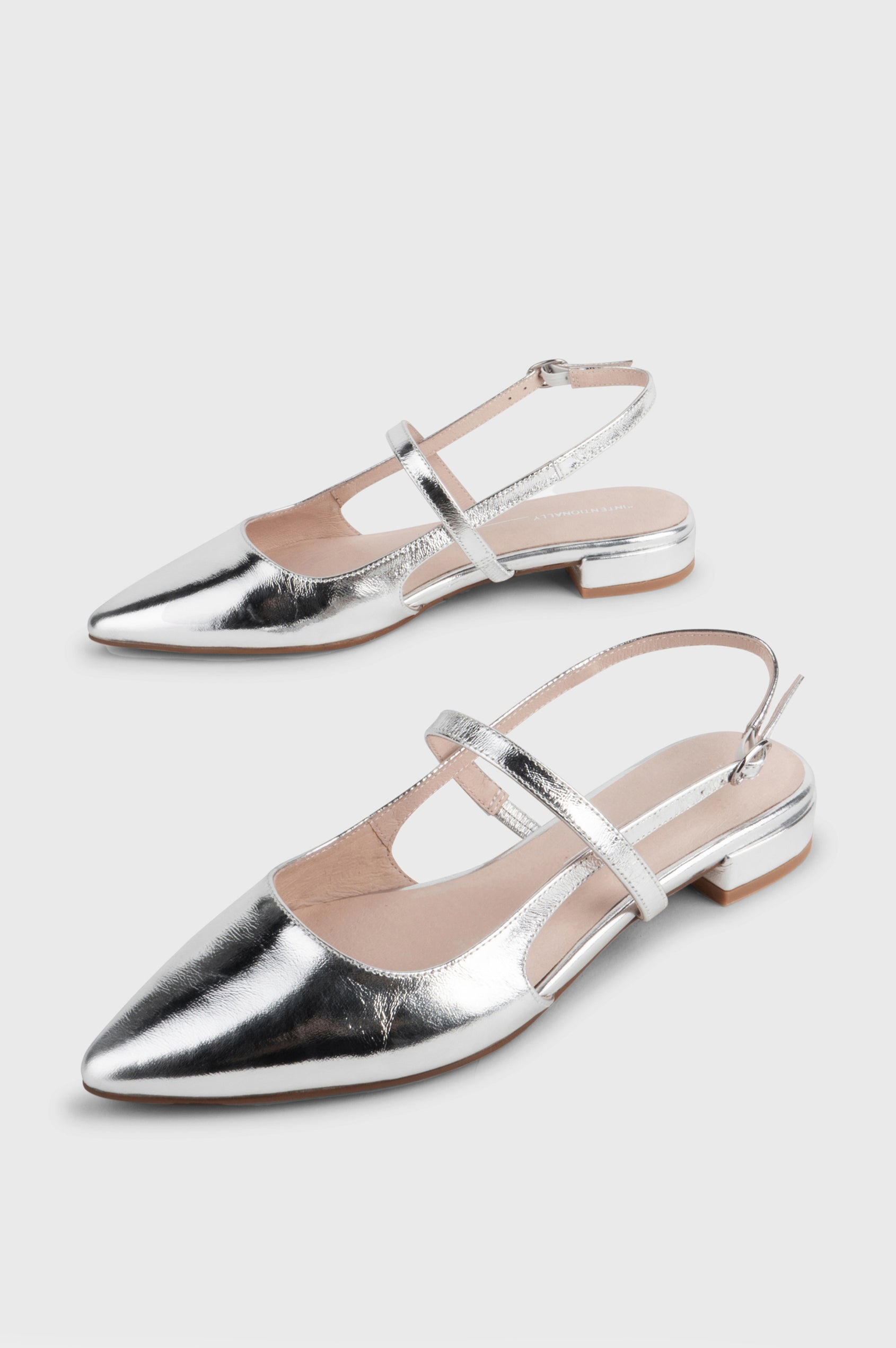 Felix slingback flat with pointed toe and mary jane style strap in metallic Mercury color - side angle of shoe pair