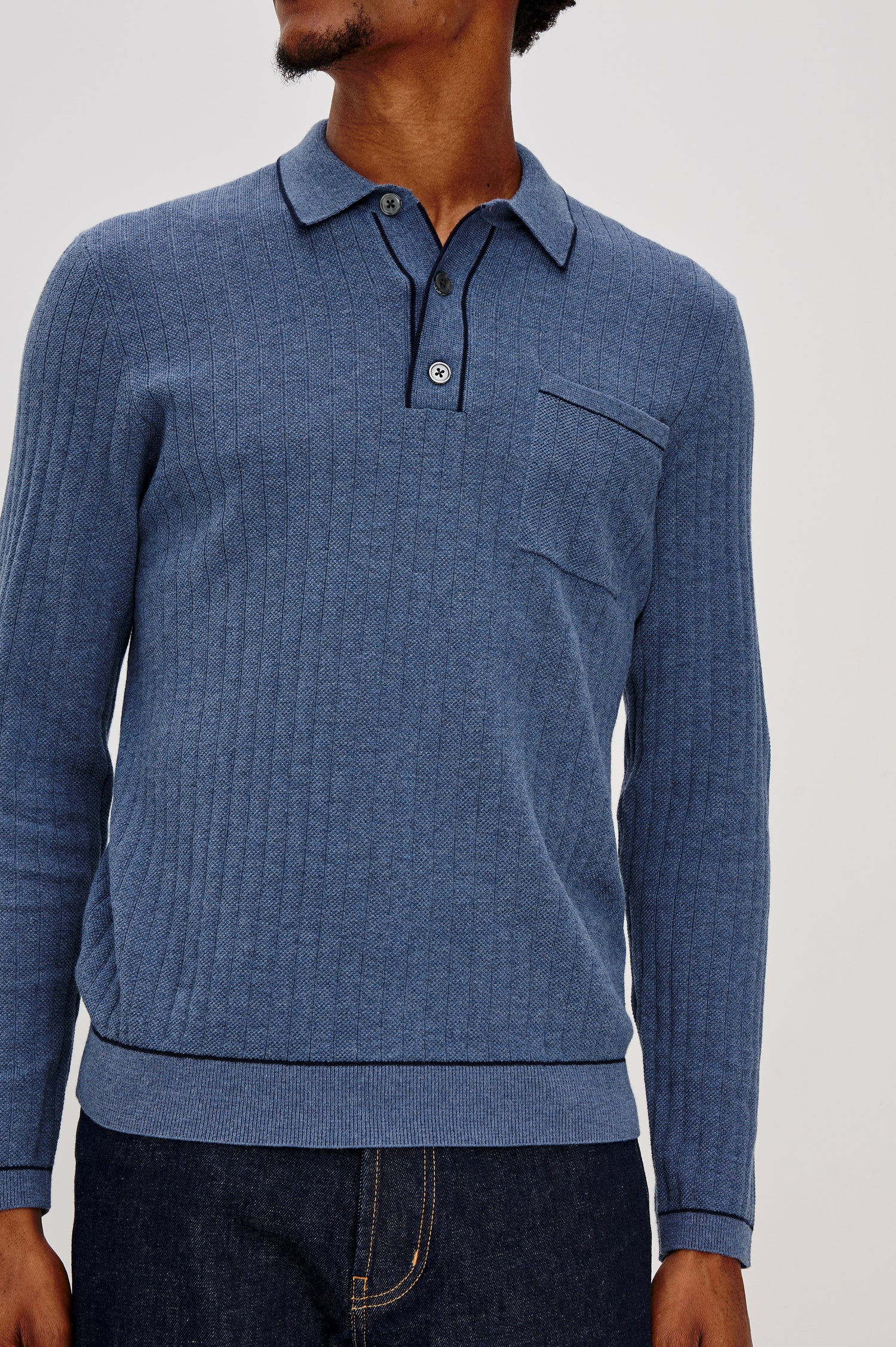 Fenton features a chest pocket, a button placket, and contrast stitching at the collar, hem and sleeves. Front view featured on model.