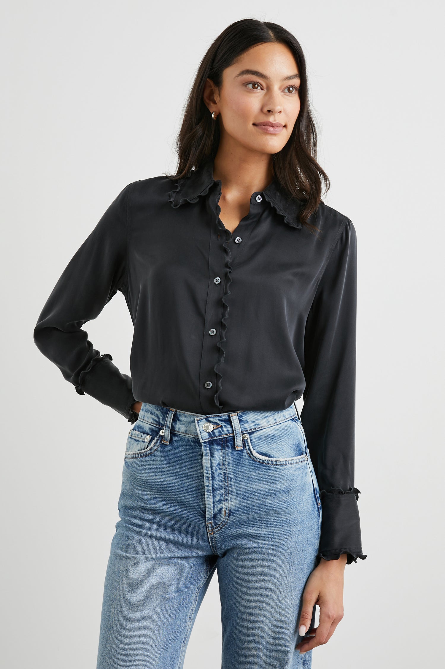 Fia Long-Sleeve Button Up with Lettuce Edges on the Collar, Cuffs, and Closure in Ivory Colorway - Front Tucked View Featured on Model 