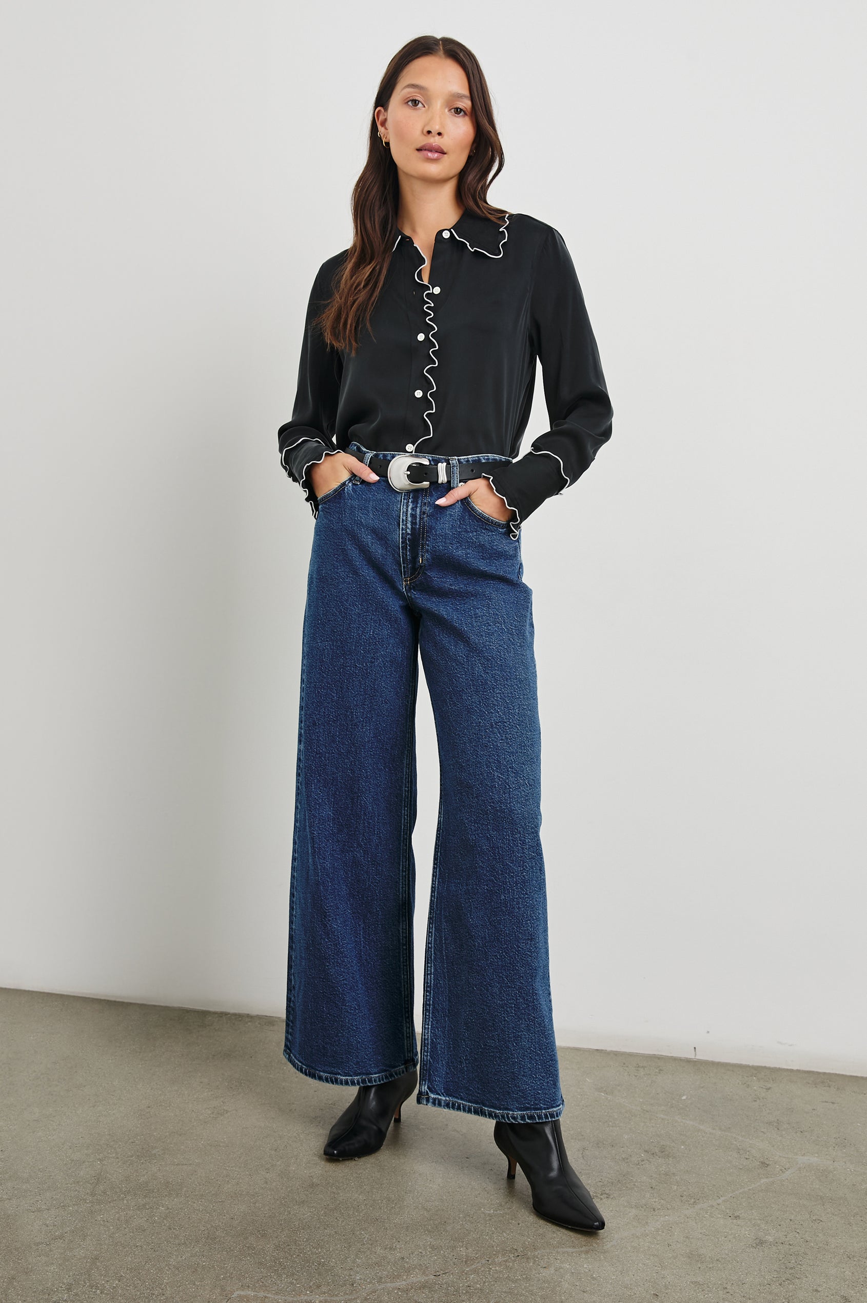 Fia Long-Sleeve Button Up with White Lettuce-Edge Piping on the Collar, Cuffs, and Closure in Black White Piping Colorway - Front Full Body View Featured on Model 