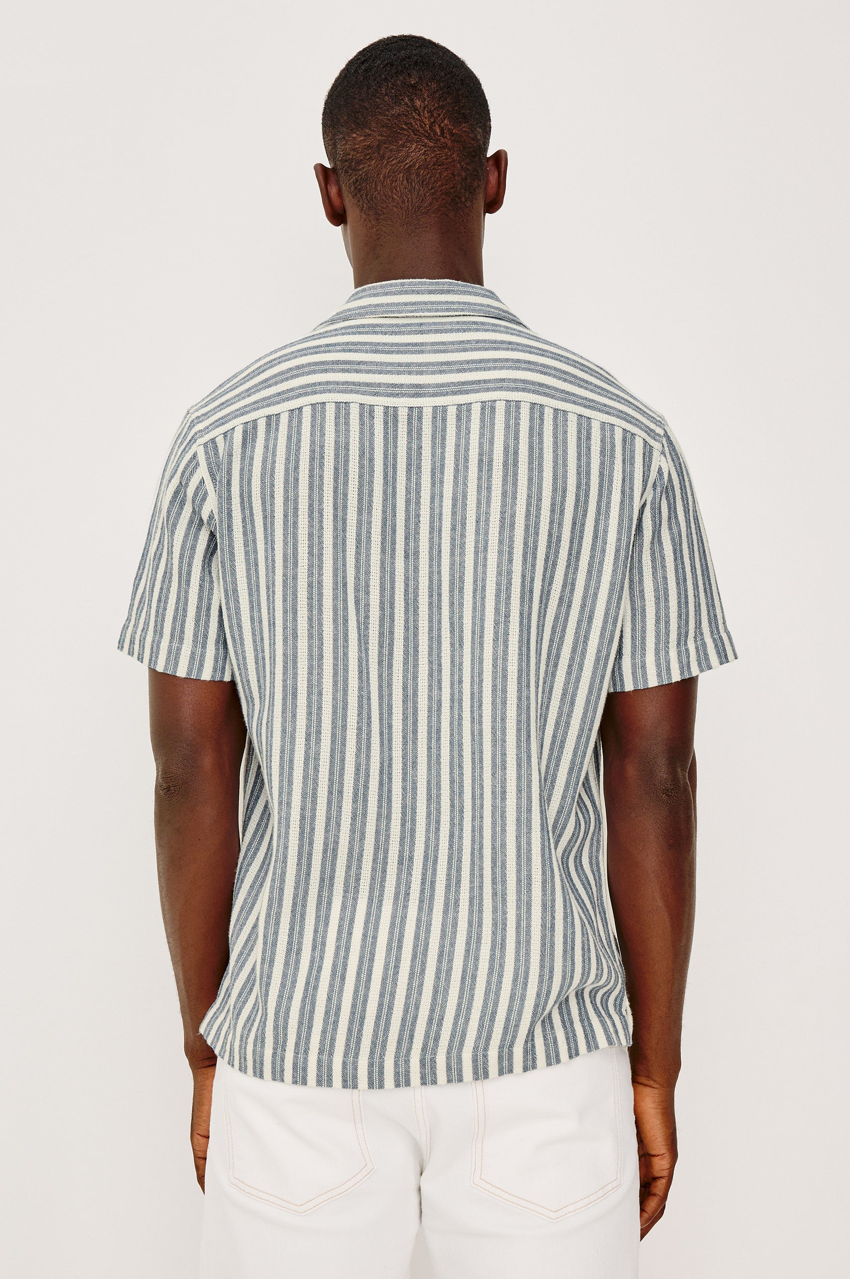 Fielder Button Front Shirt With Short Sleeves and Relaxed Boxy Fit in Marine White Stripe Colorway - Upper Body Back View Featured on Model