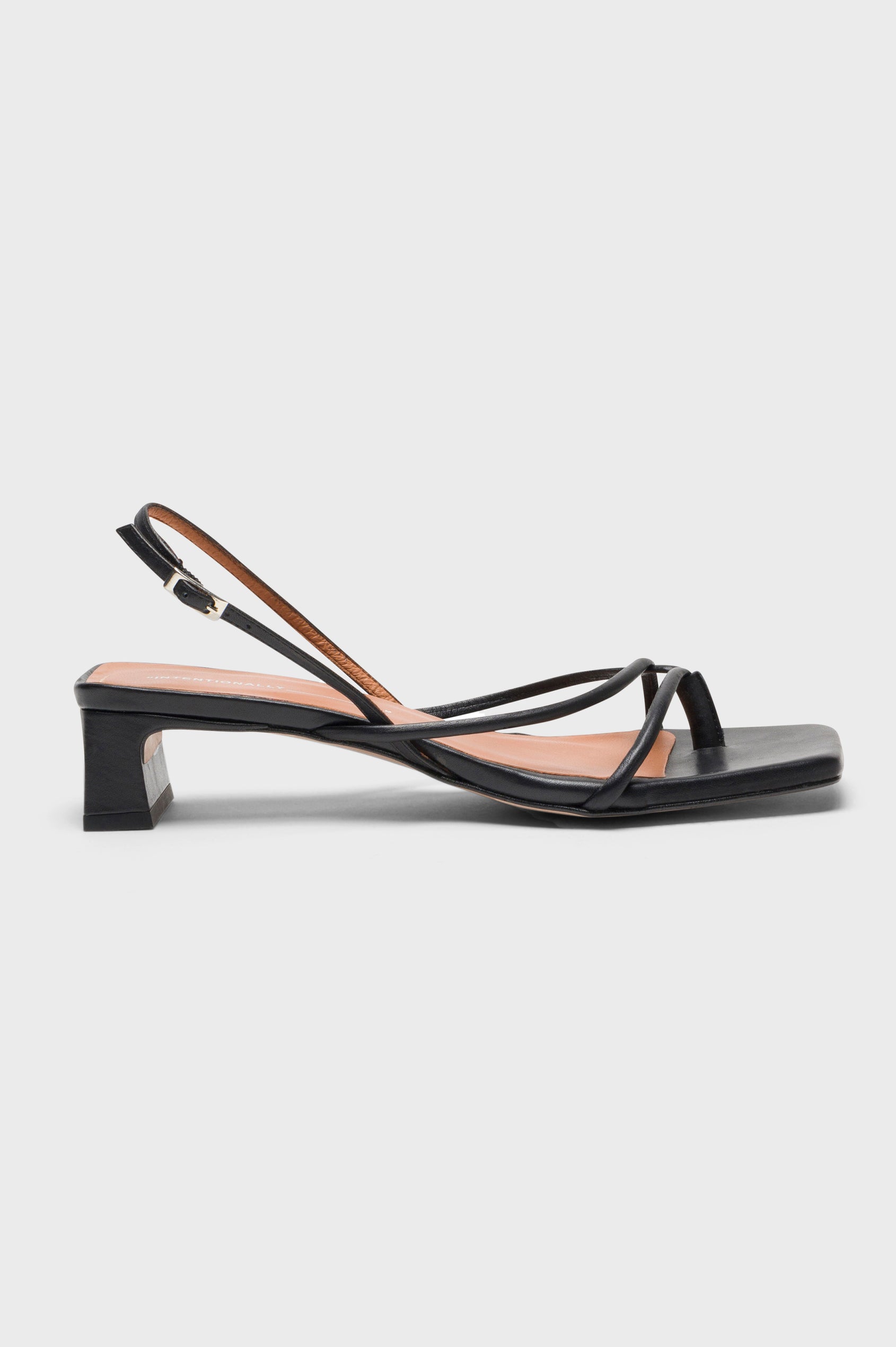 Fifi strappy slingback shoe with a block heel and adjustable heel strap in Black colorway - side view of single shoe