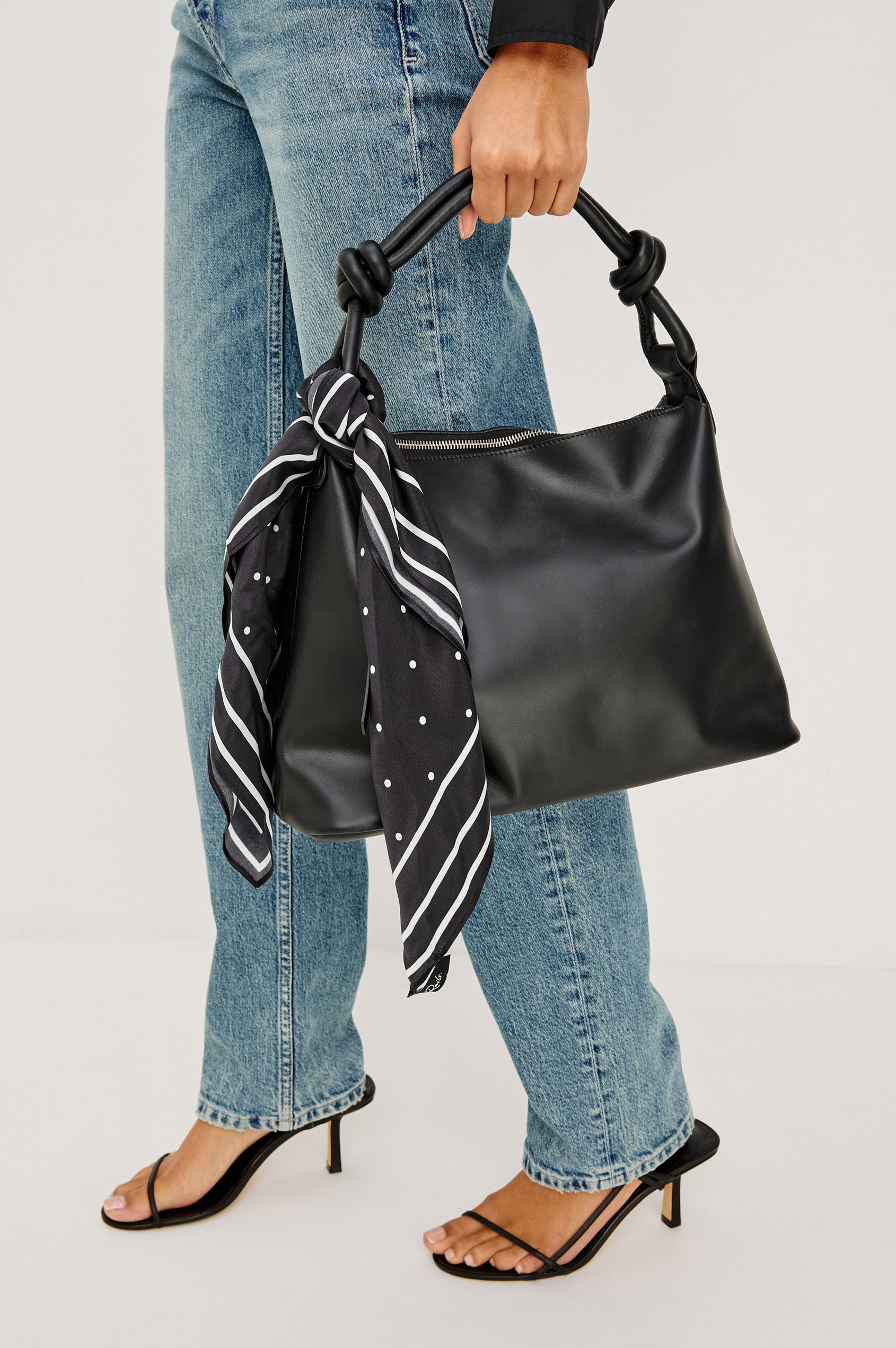 Finna Square Scarf in 100% Silk With Contrast Polka Dots and Striped Outline in Black Colorway - Stylized View Featured on Model