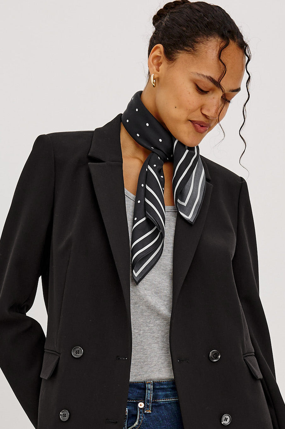 Finna Square Scarf in 100% Silk With Contrast Polka Dots and Striped Outline in Black Colorway - Stylized View Featured on Model