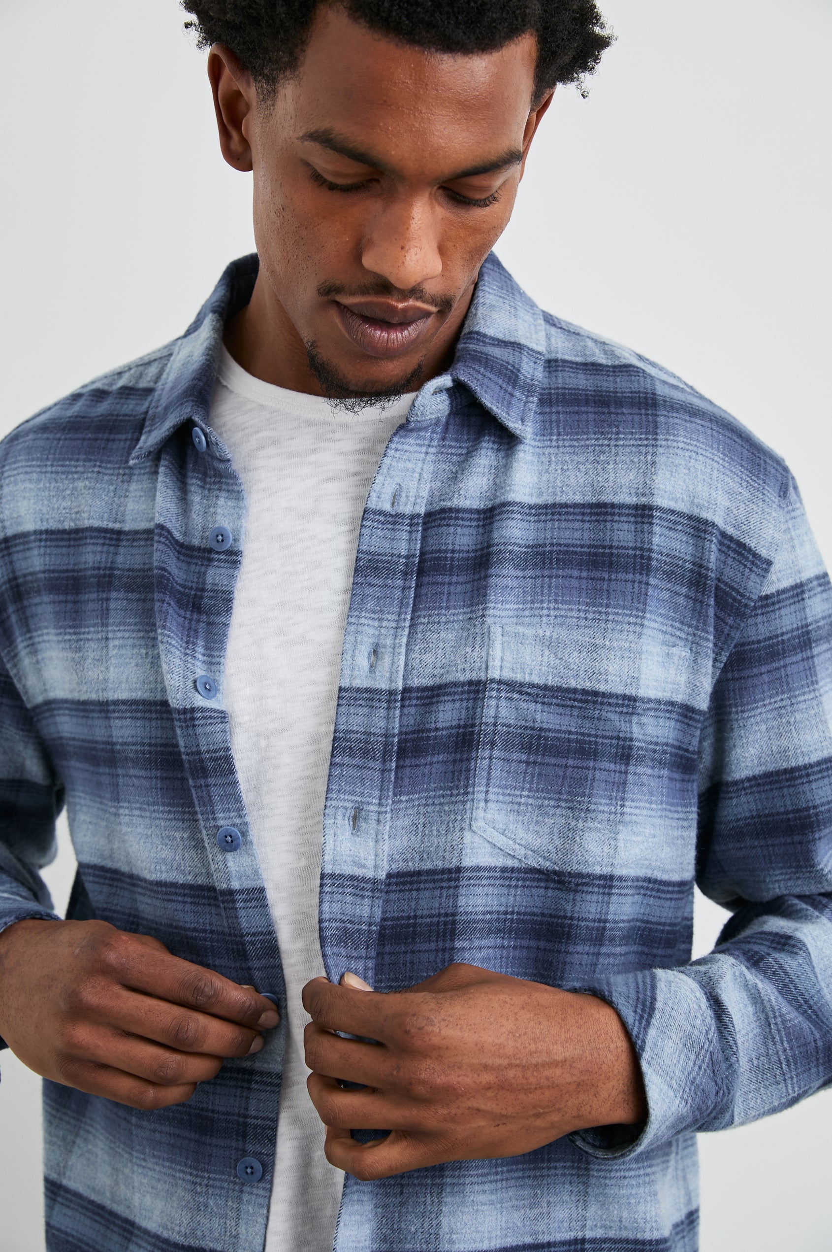 Forrest Long-Sleeve Button Up with a Chest Patch Pocket in Lightning Portal Colorway, a plaid in blues - Front Unbuttoned View Featured on Model