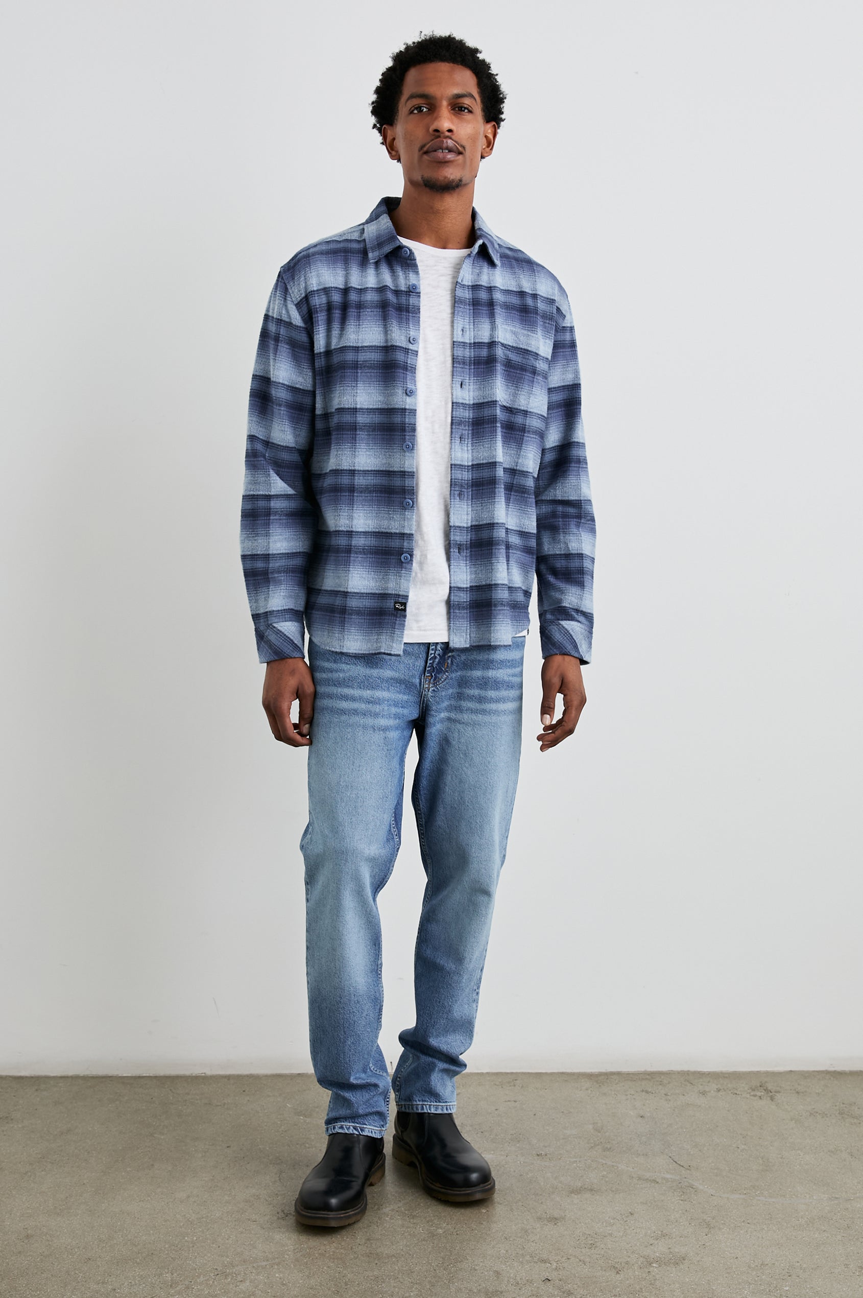 Forrest Long-Sleeve Button Up with a Chest Patch Pocket in Lightning Portal Colorway, a plaid in blues - Front Full Body View Featured on Model