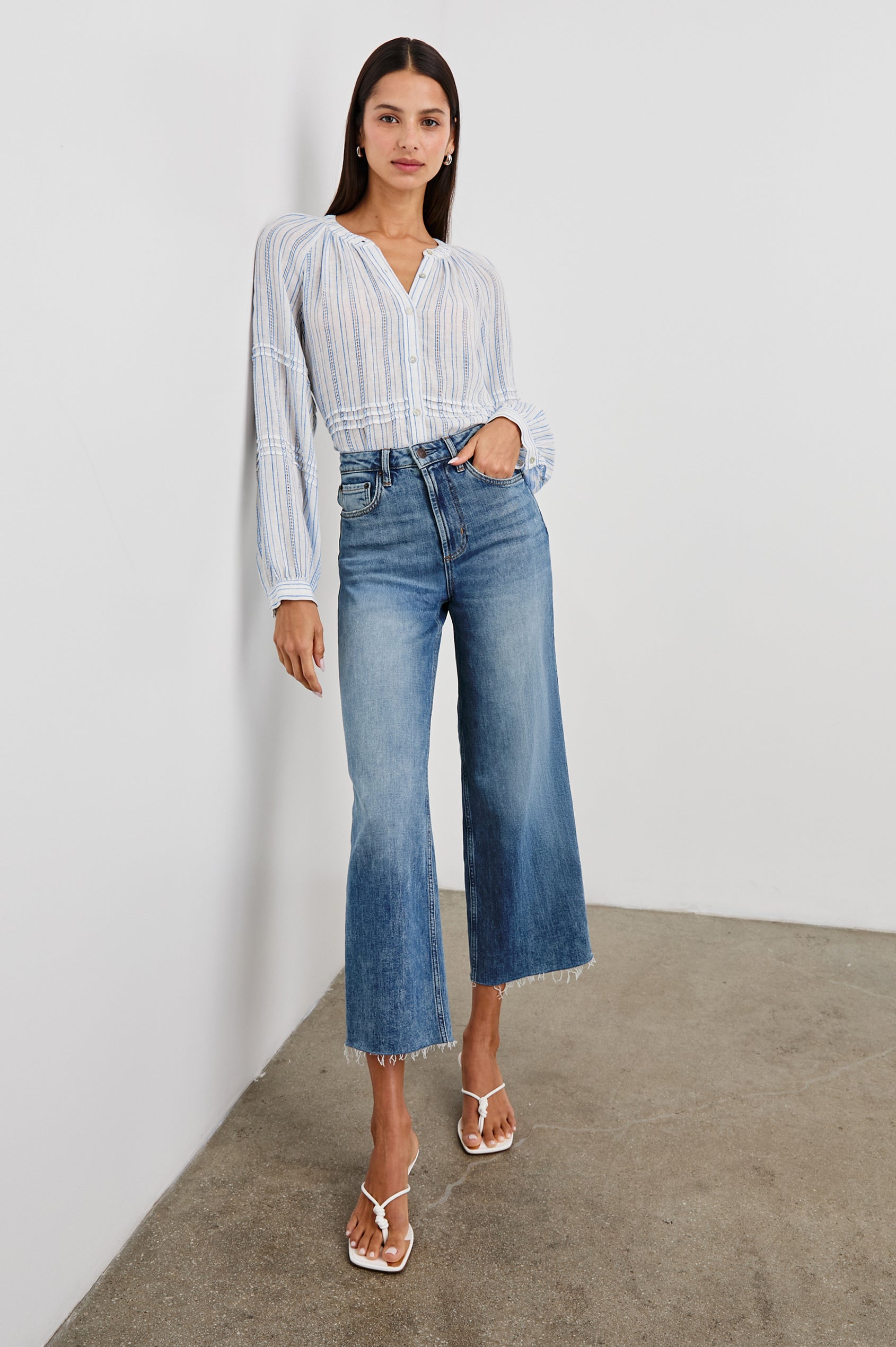 Frances Long-Sleeve Top with Buttons Down the Front, Button Cuffs, and Pleating Around the Neckline in Sonoma Stripe Colorway, Thin Blue Vertical Stripes on White - Front Full Body View Featured on Model