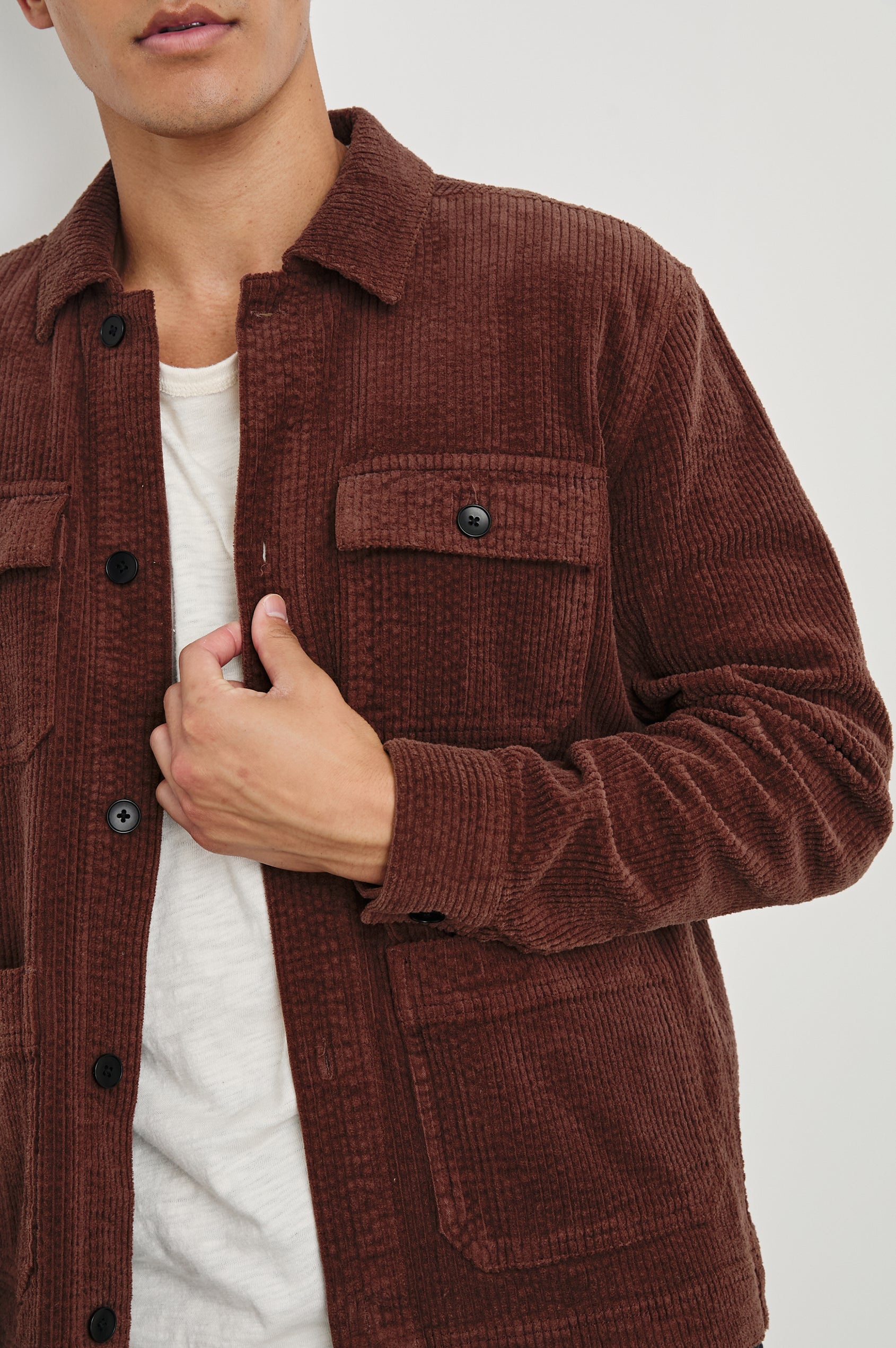 Franklin Corduroy Jacket with Button Closure, Two Front Patch Pockets and Two Chest Button Flap Pockets in Brick Colorway - Front View Featured on Model