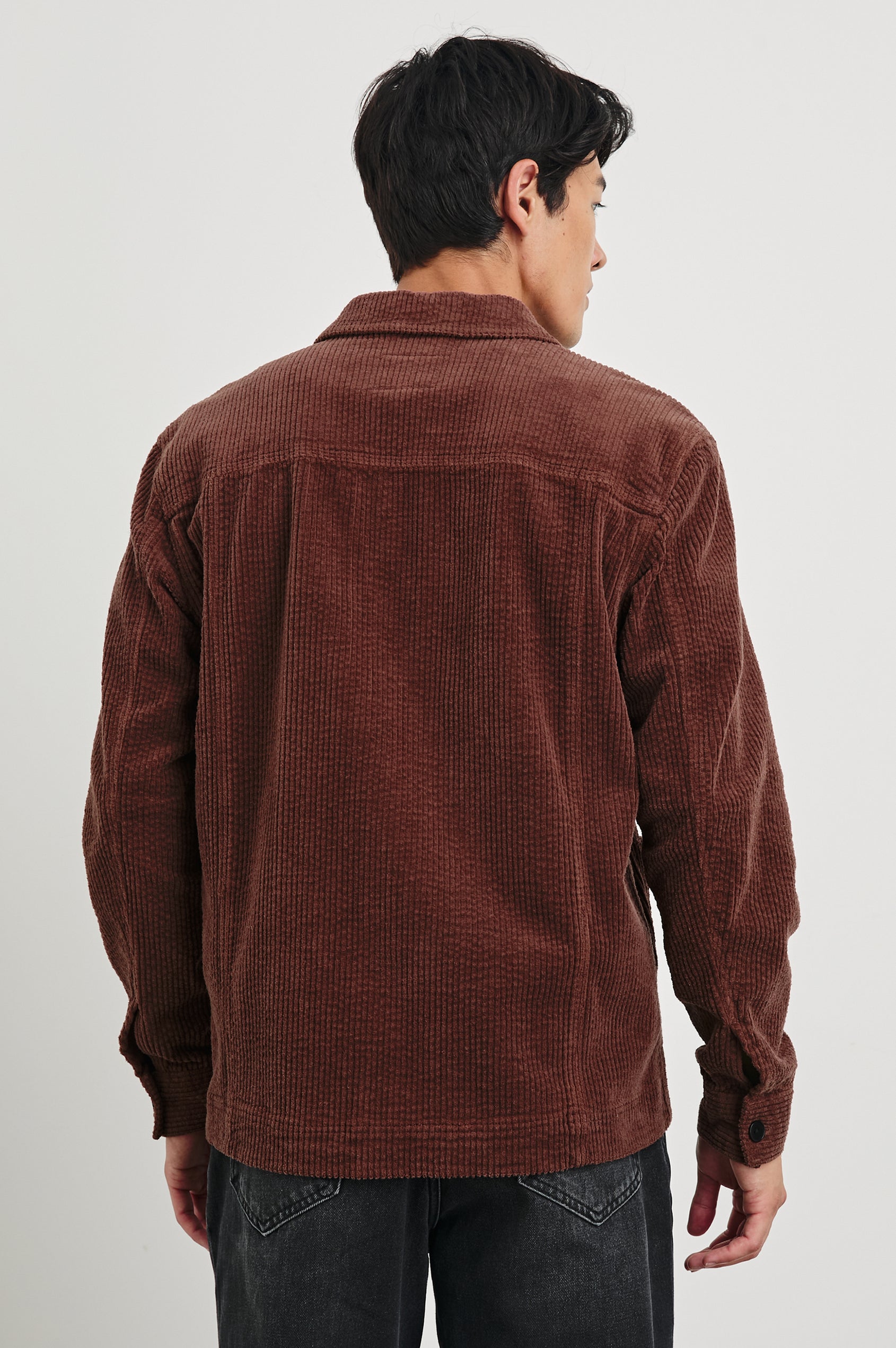 Franklin Corduroy Jacket with Button Closure, Two Front Patch Pockets and Two Chest Button Flap Pockets in Brick Colorway - Back View Featured on Model