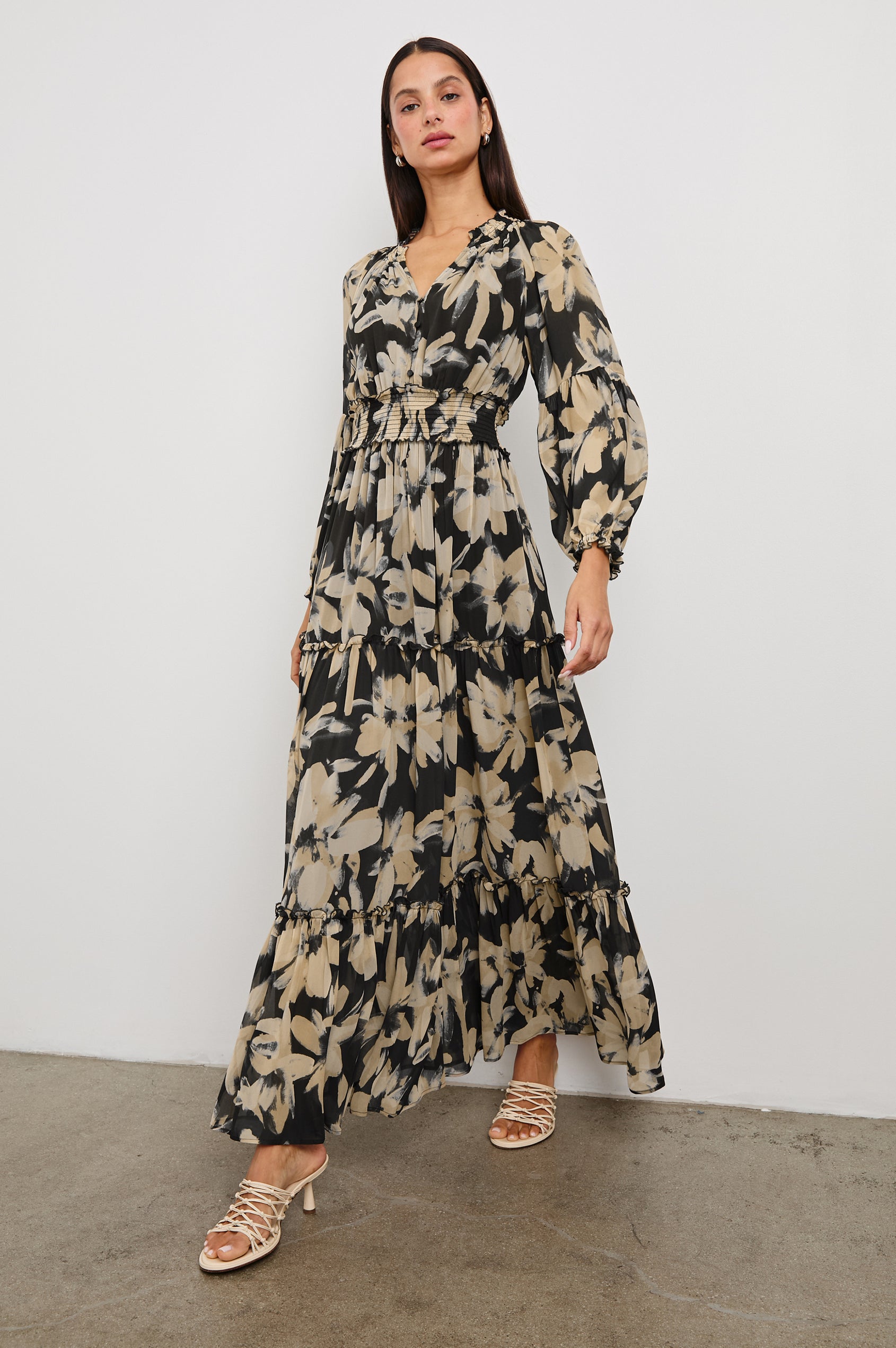 Frederica long sleeve flowy maxi dress with smocked neckline and waist and tiered skirt in Charcoal Lily - full body front view on model