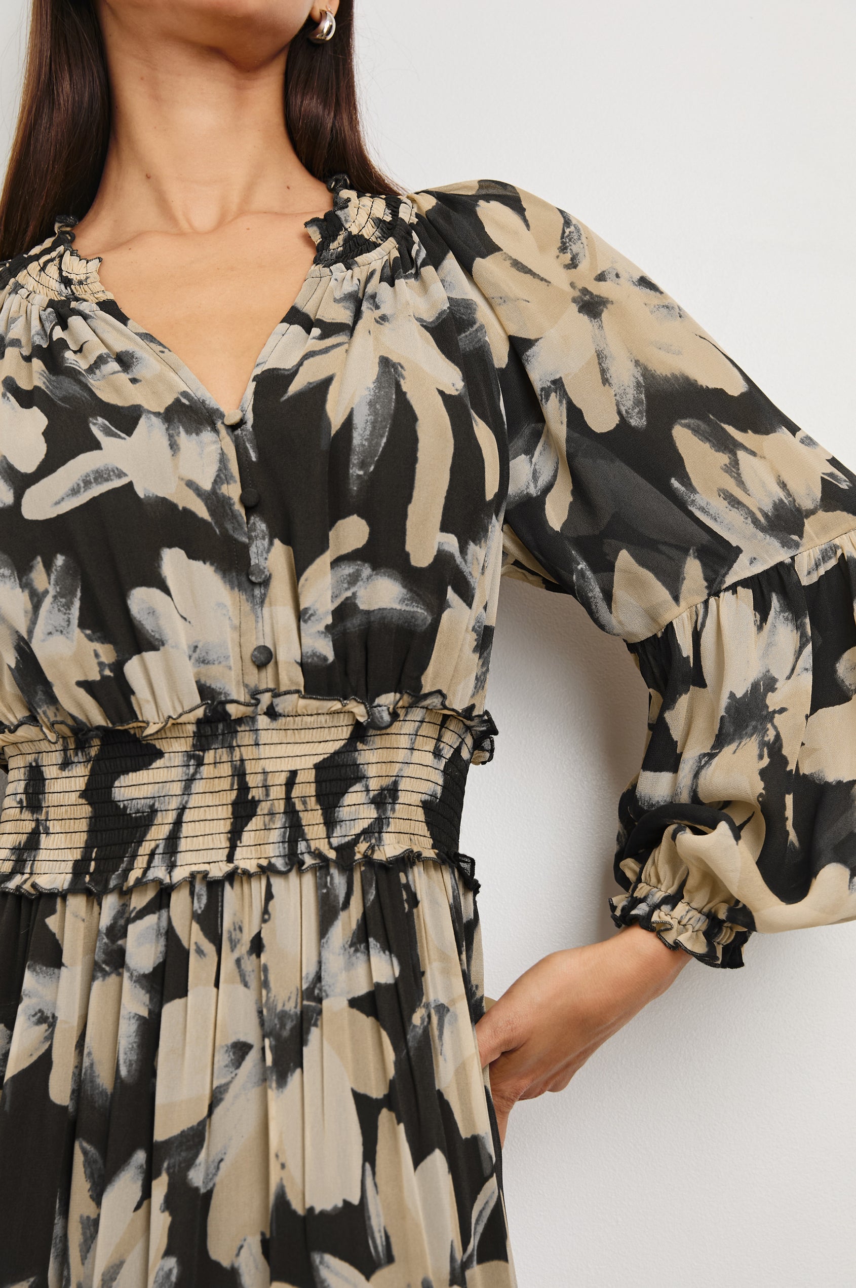 Frederica long sleeve flowy maxi dress with smocked neckline and waist and tiered skirt in Charcoal Lily - close up of details on model