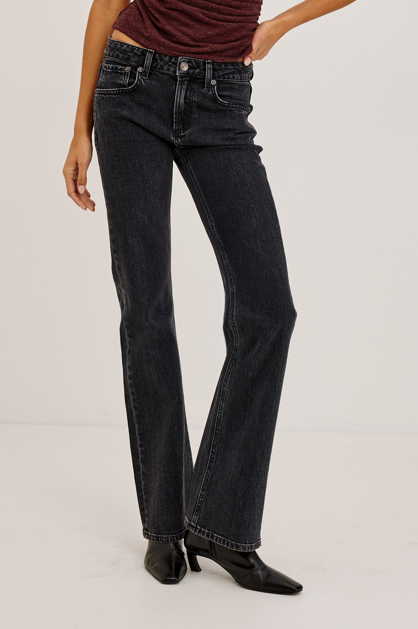 Fremont Low Rise Bootcut Jean in Light Stretch Denim With Extended Inseam, 5-Pockets, Belt Loops, and Zip-Fly Closure in Blackjack Colorway - Lower Body Front View Featured on Model