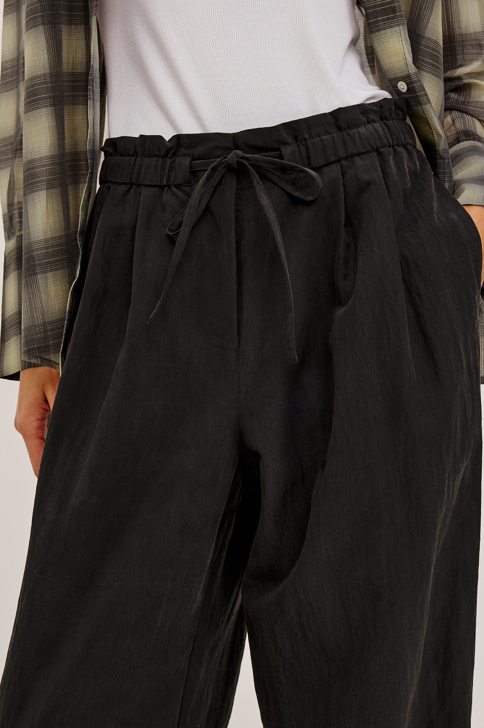 Fulham Pant in Nylon With Mid-Rise Wide Leg Fit, Front Pleats, Back Patch Pockets, Back Hem Buttons to Adjust Leg Wide to Slim in Black Colorway - Lower Body Front View Featured on Model