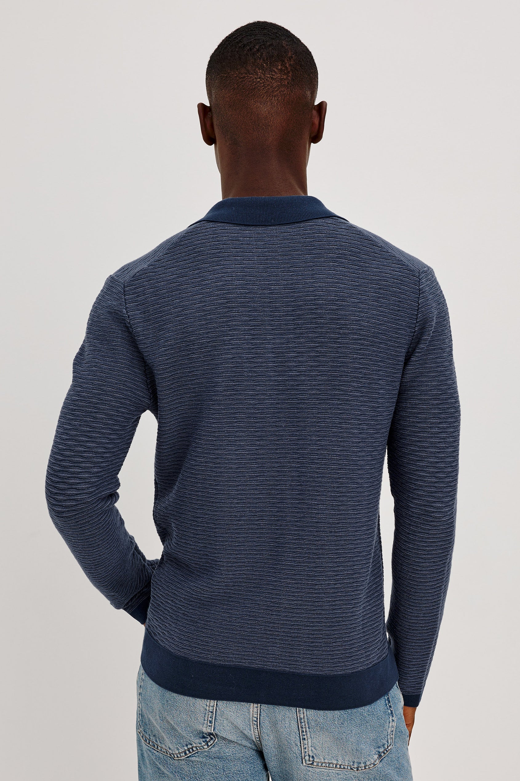 Fulton Sweater in Lightweight Cotton Knit With Raglan Long Sleeves, Two-Button Placket, Collar, and Tonal Texture in Navy Wave Colorway - Upper Body Back View Featured on Model